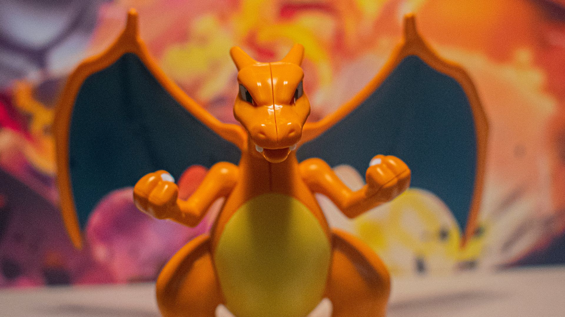 a toy figure of a yellow pokemon sitting on top of a table