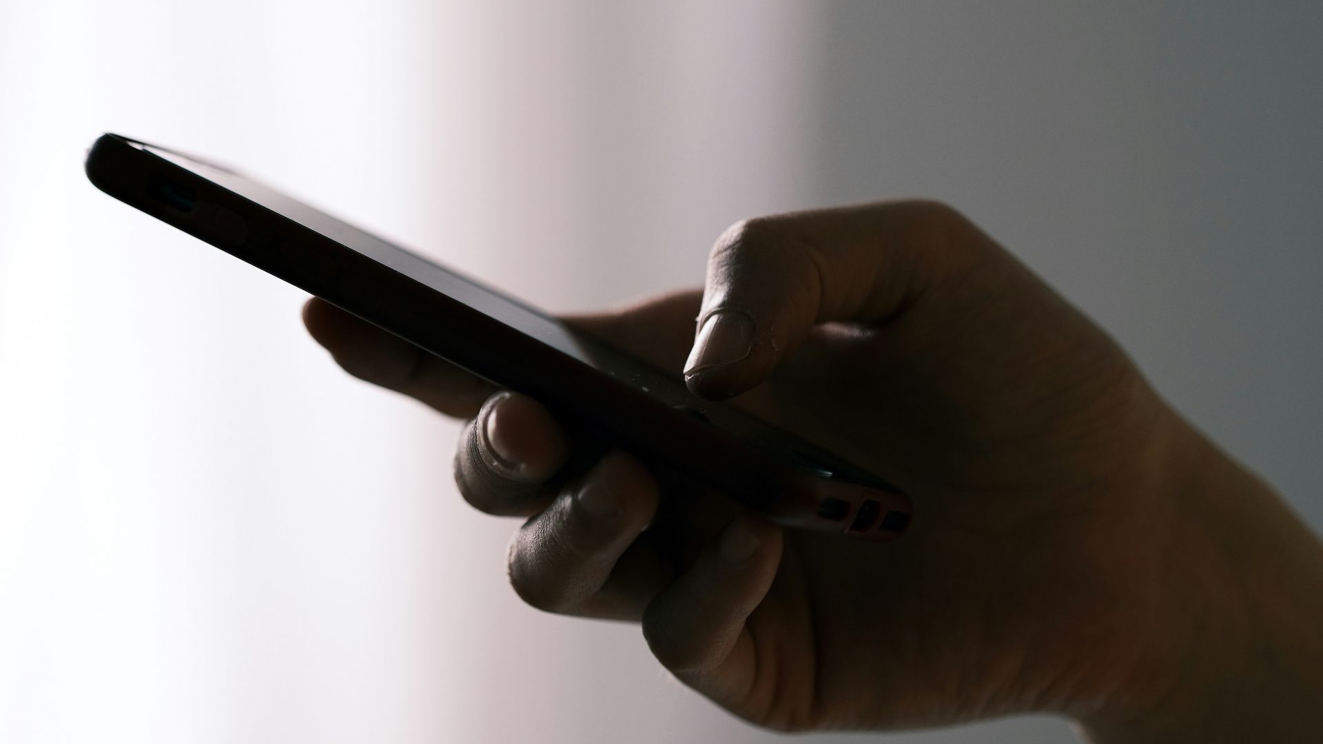 person holding black android smartphone