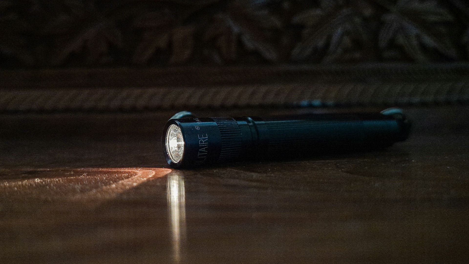a flashlight sitting on the floor of a room