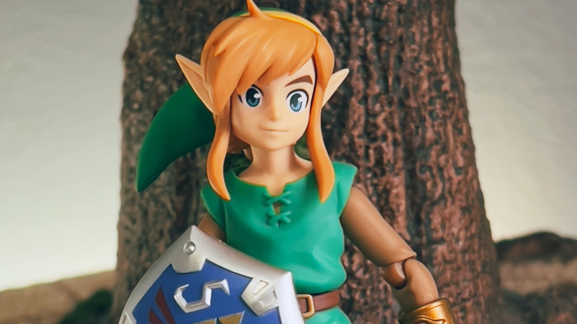 a toy girl holding a sign