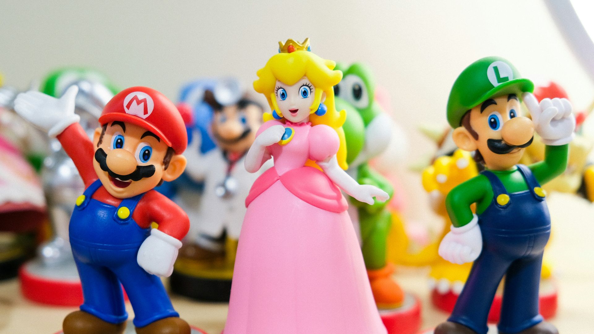 Mario, Luigi, and Princess Peach figurines