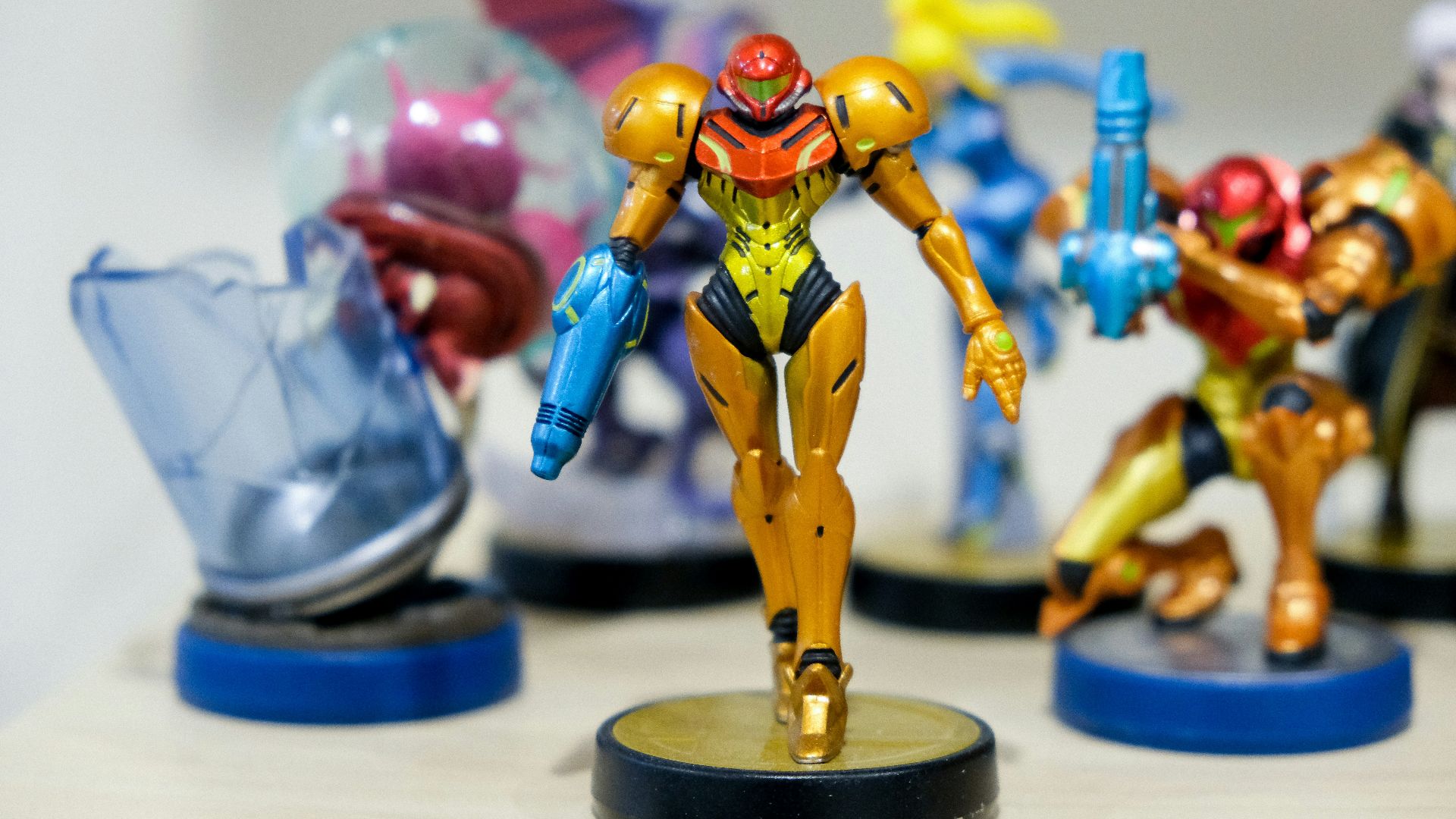 man wearing yellow and red costume character scale model