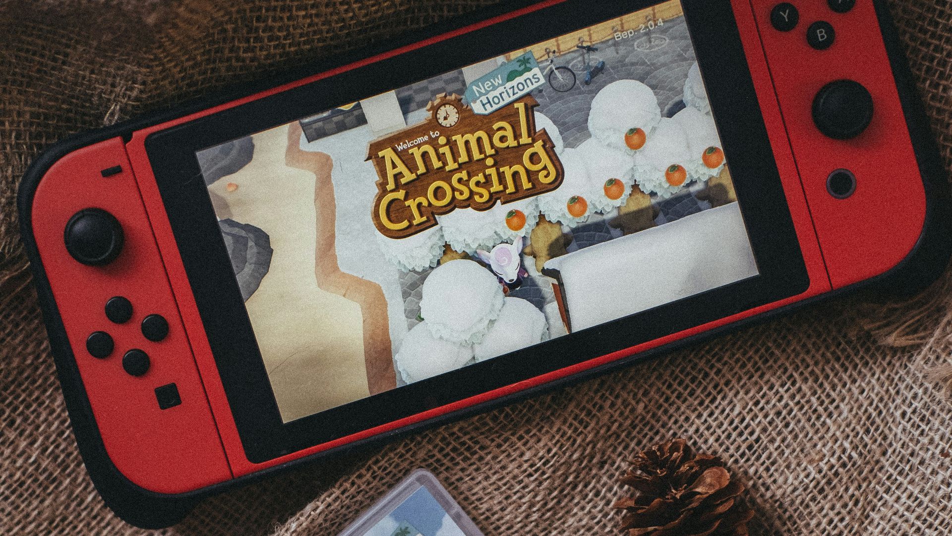 a nintendo wii game sitting on top of a blanket