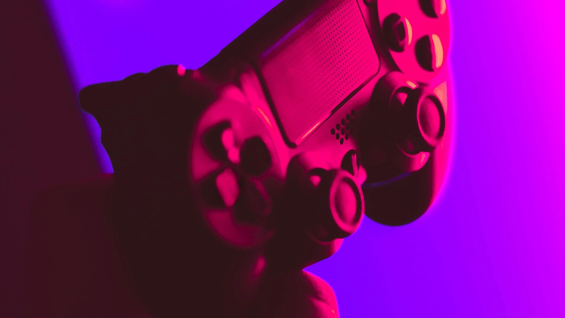 person holding black and gray game controller
