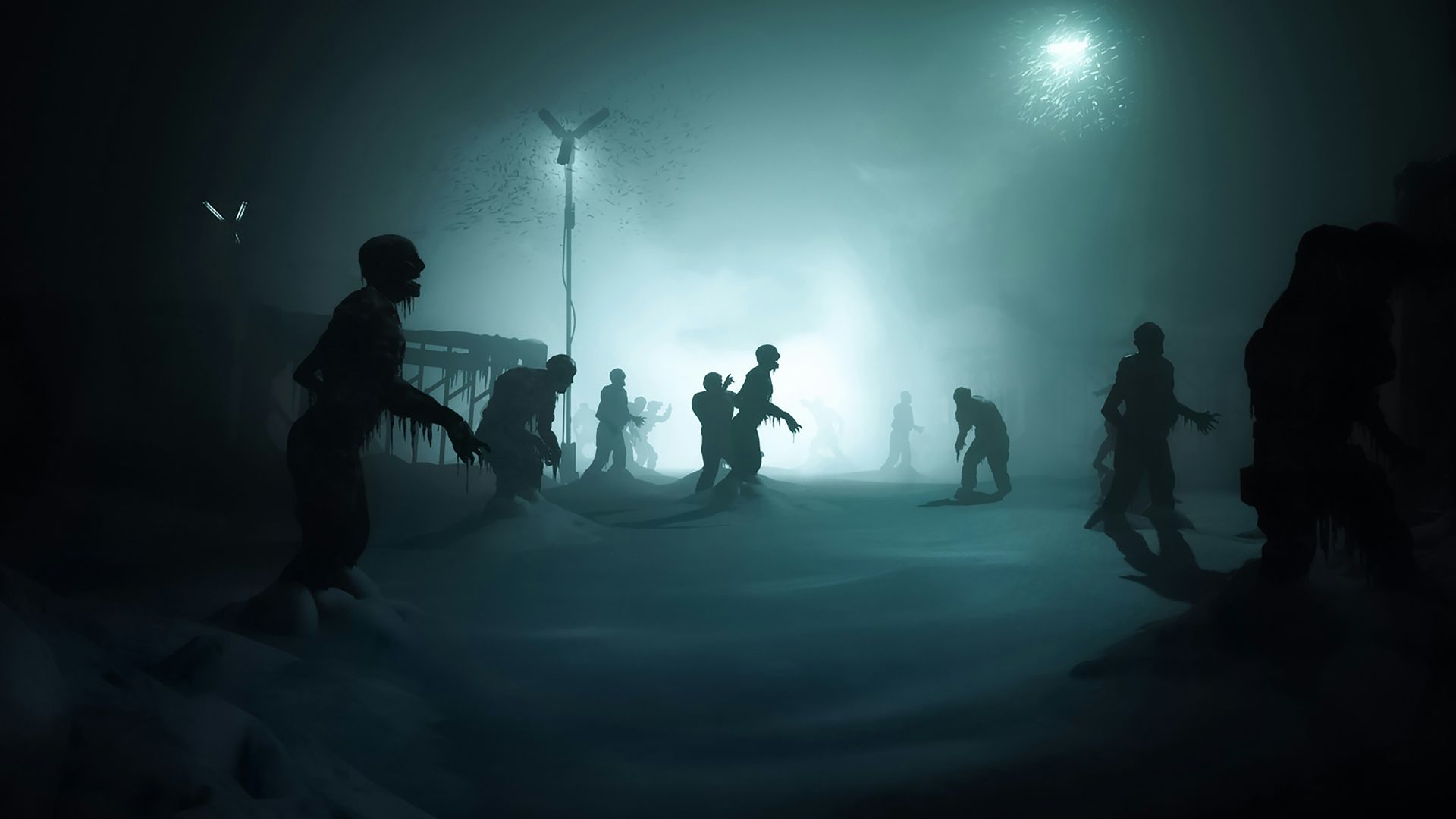 a group of people standing in the snow at night