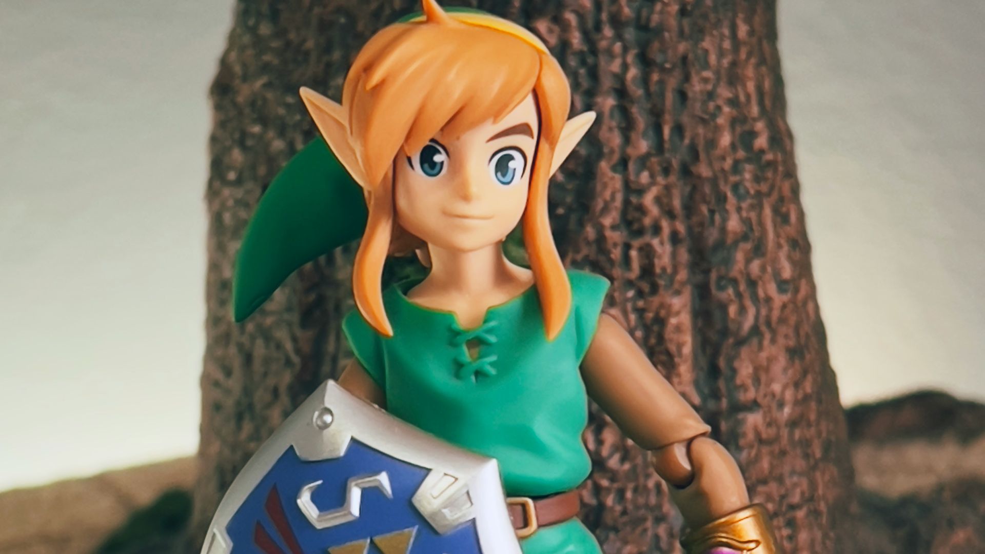 a toy girl holding a sign