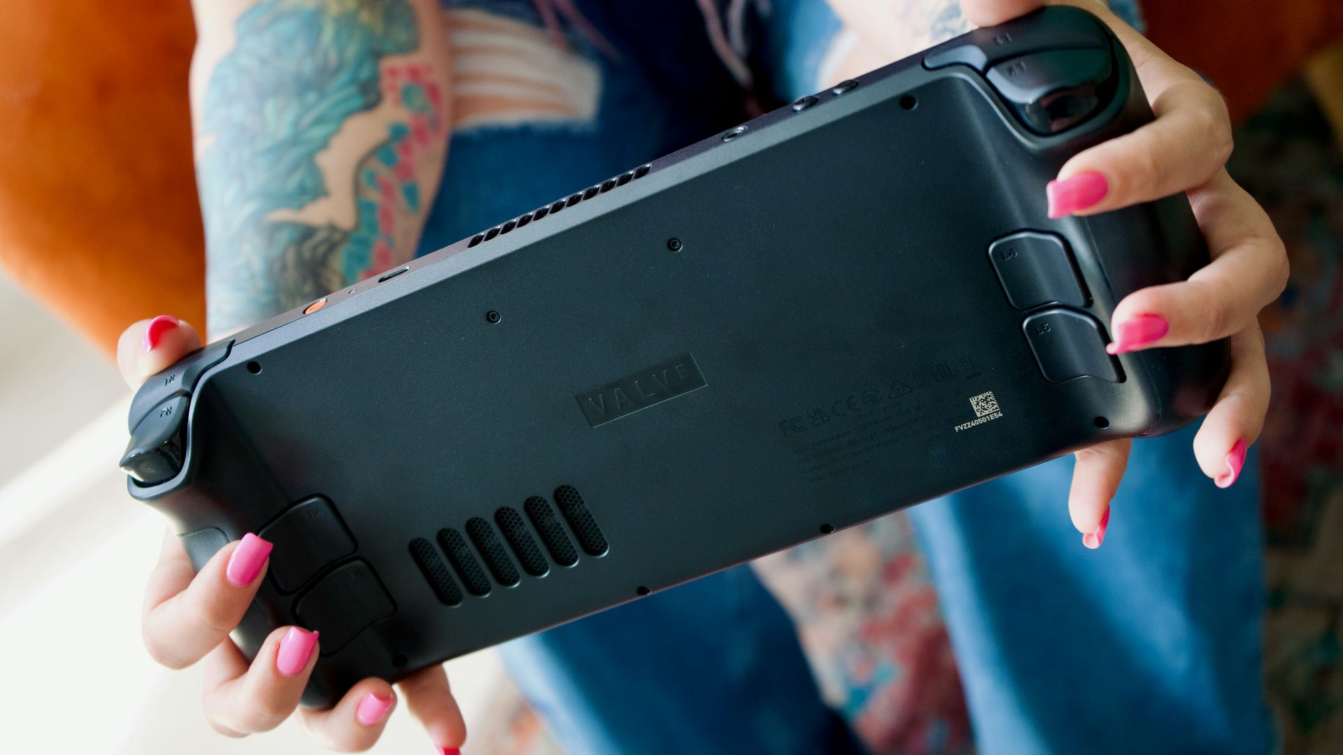 A woman holding a cell phone in her hands