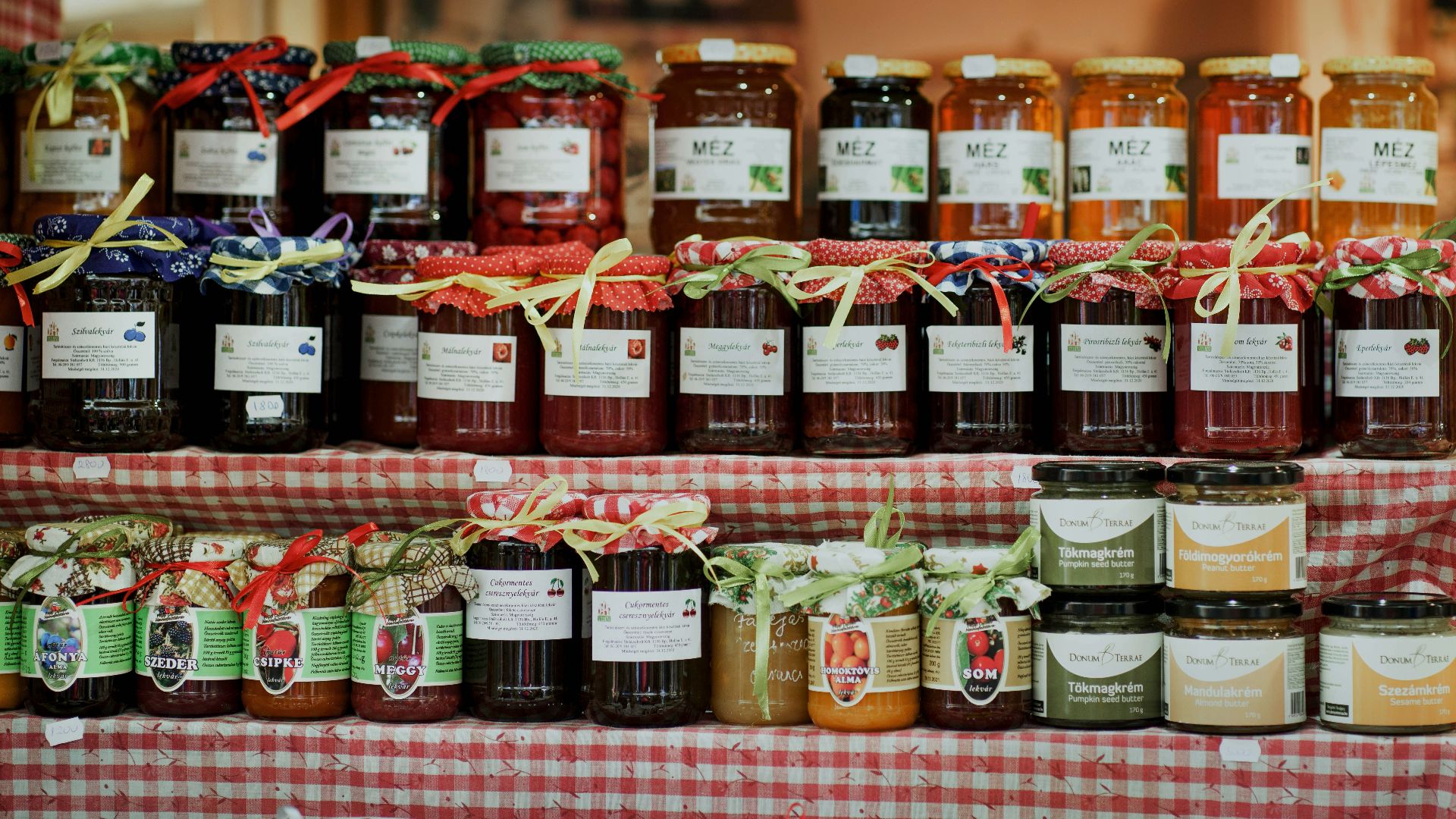 clear glass jars on brown wooden shelf