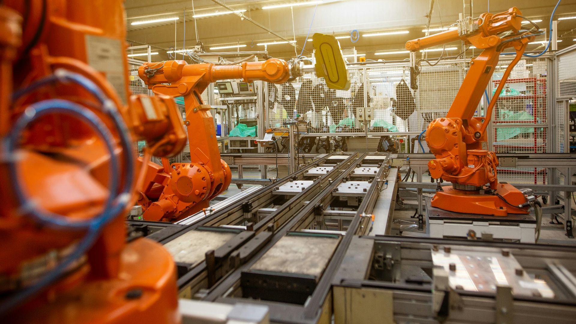 a factory filled with lots of orange machines