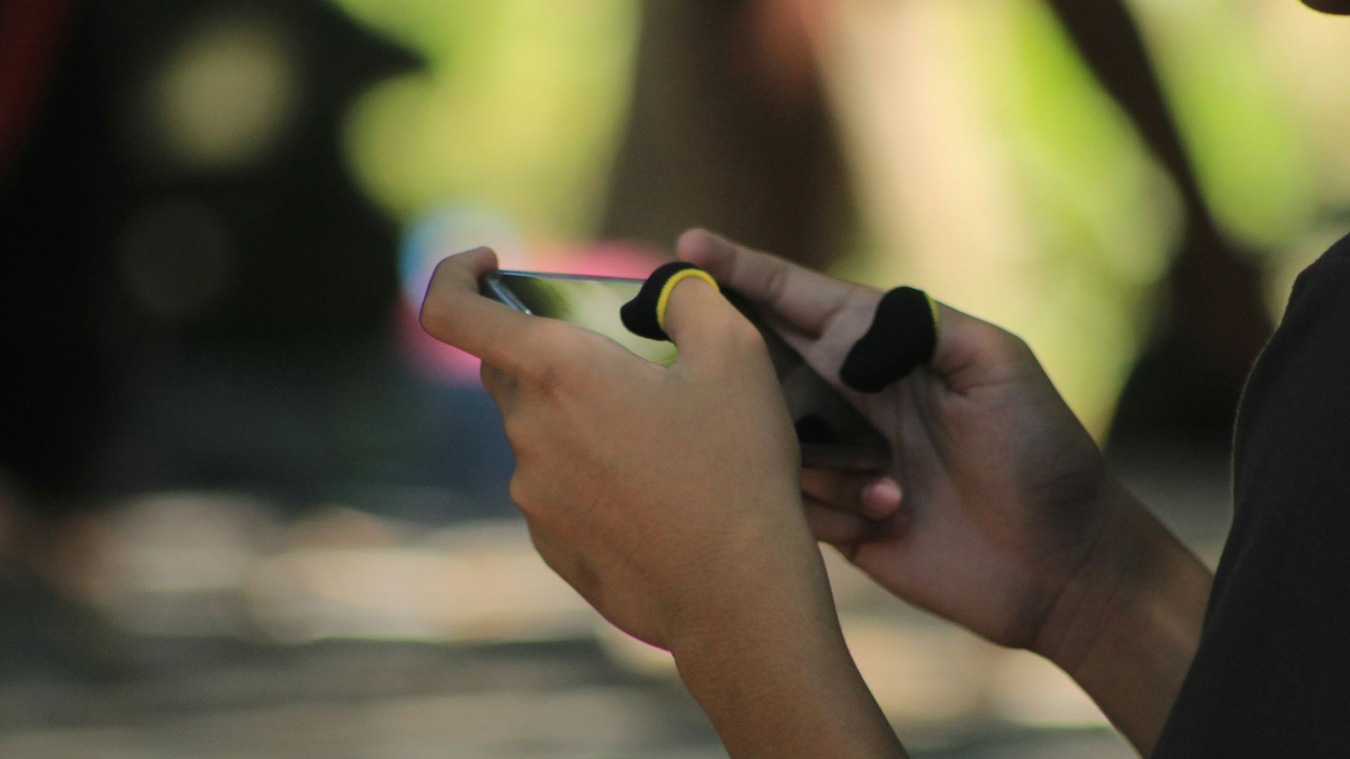 A woman is looking at her cell phone