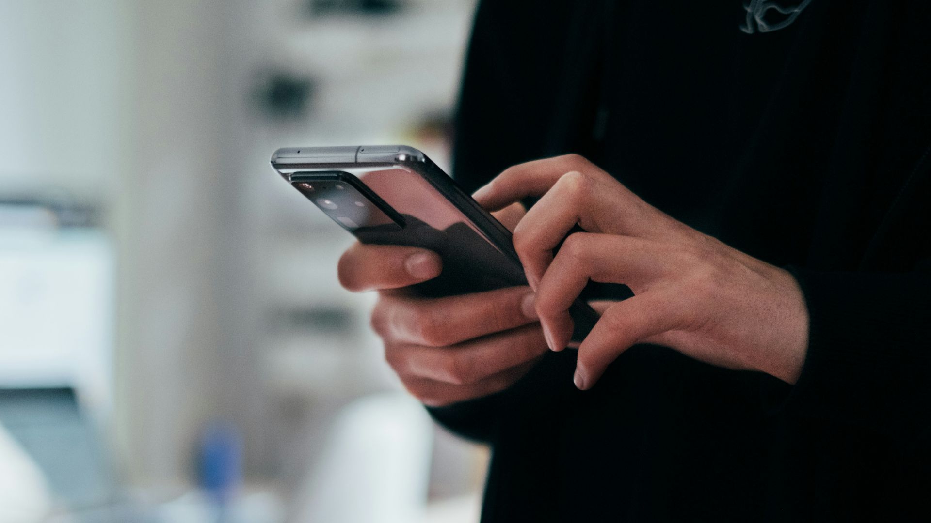 person holding black android smartphone