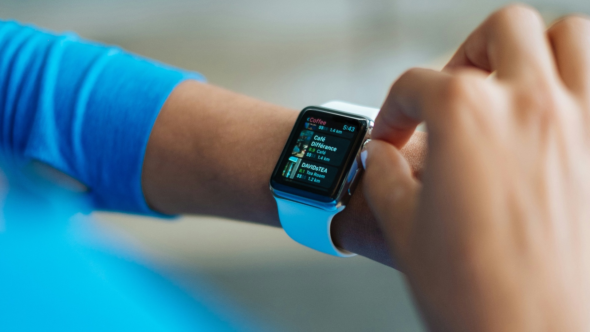 person operating smartwatch