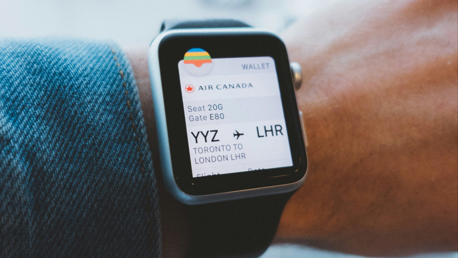 space gray aluminum case Apple Watch and black leather band turned on