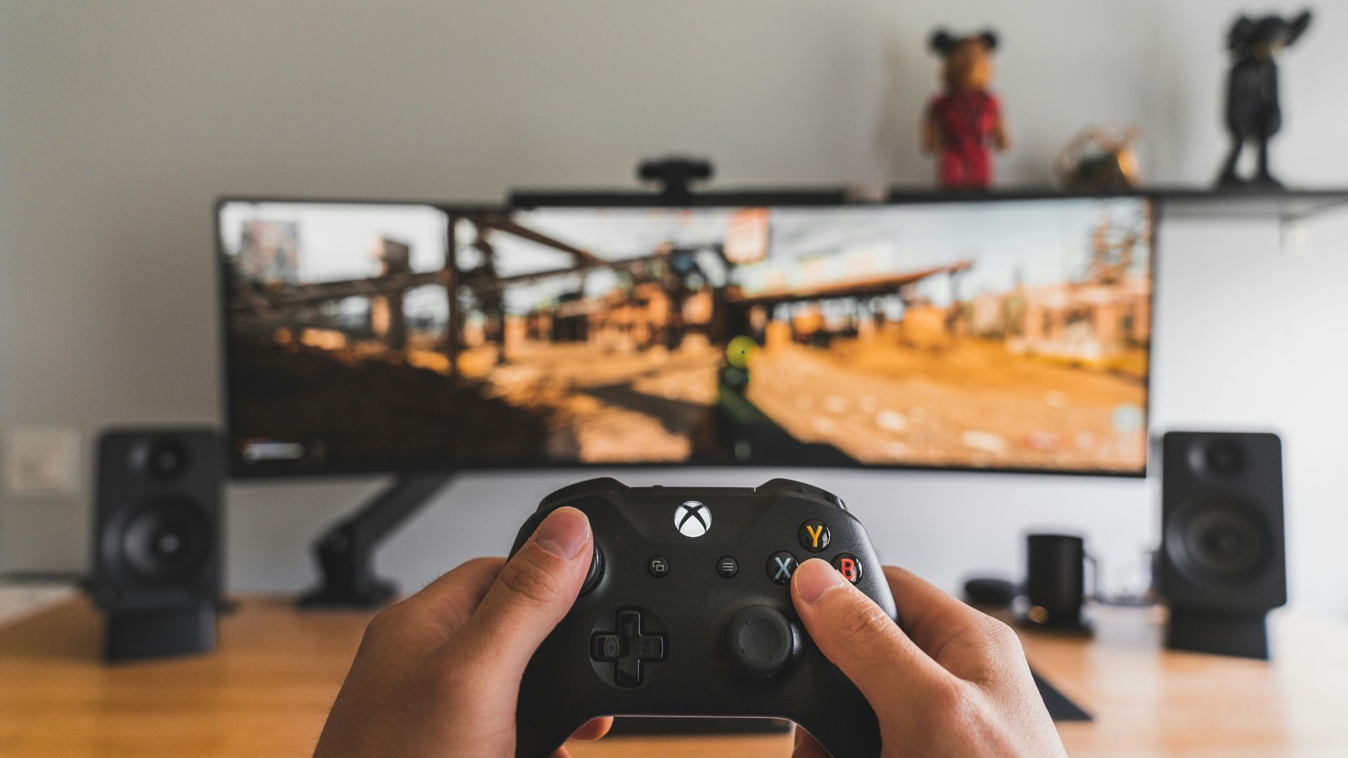 person holding black game controller