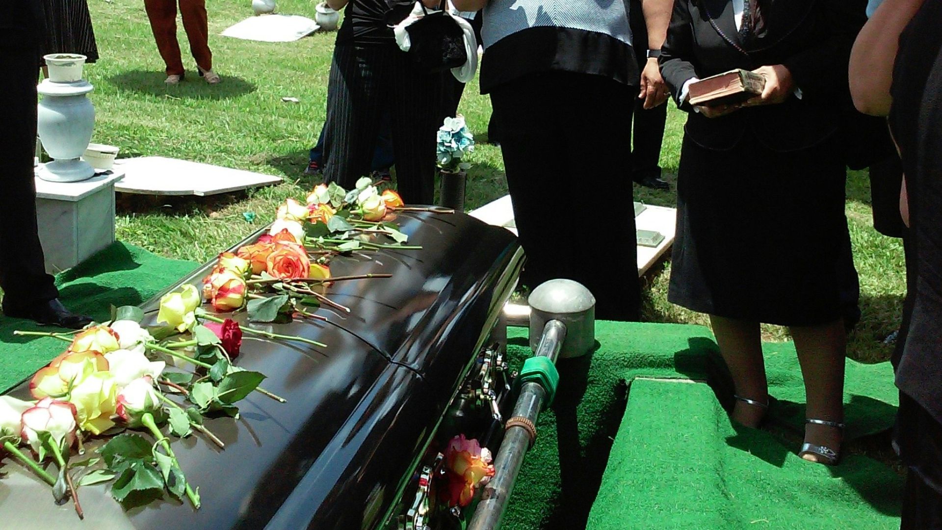 group of people attending burial