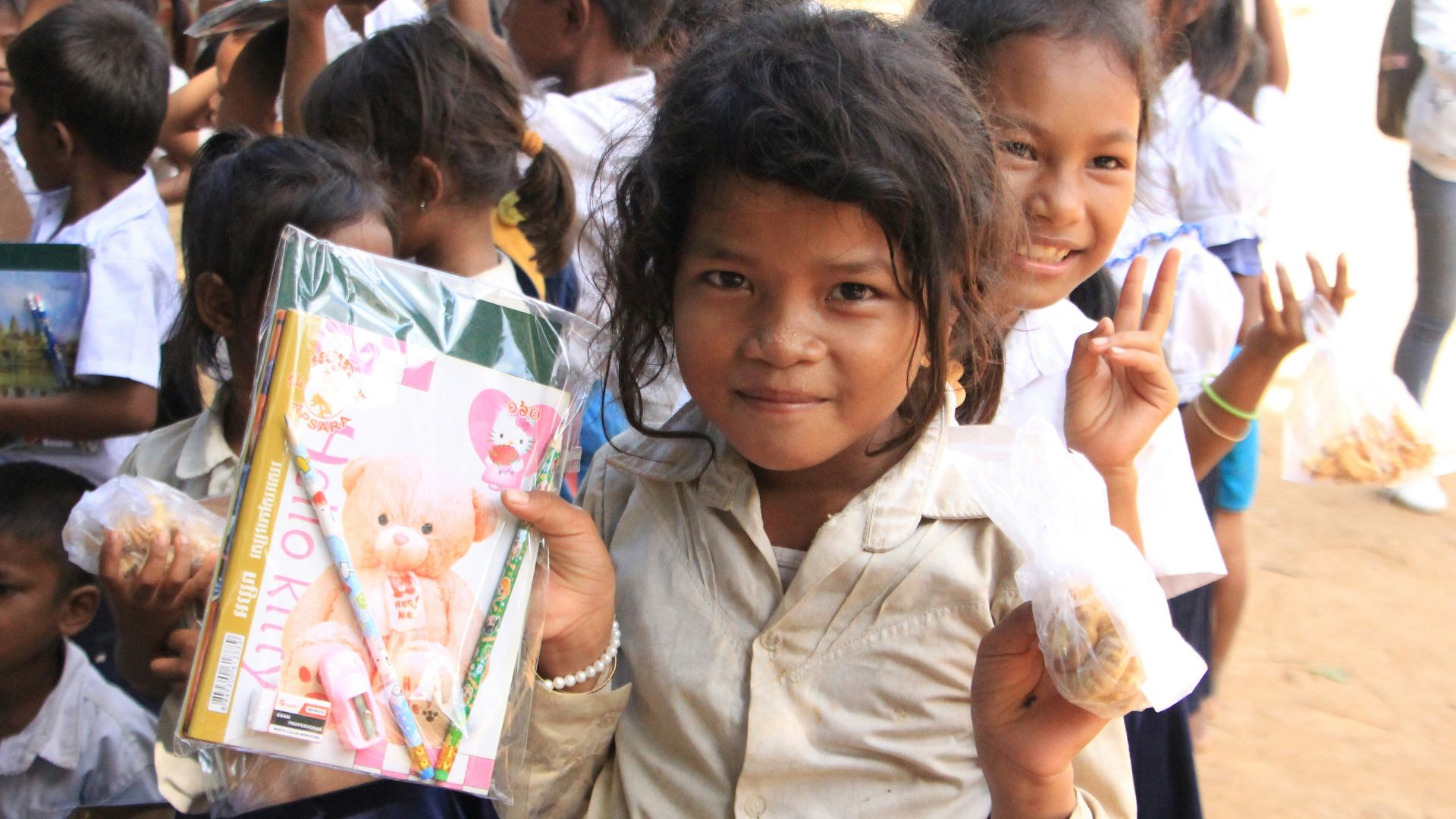 a group of young children standing next to each other