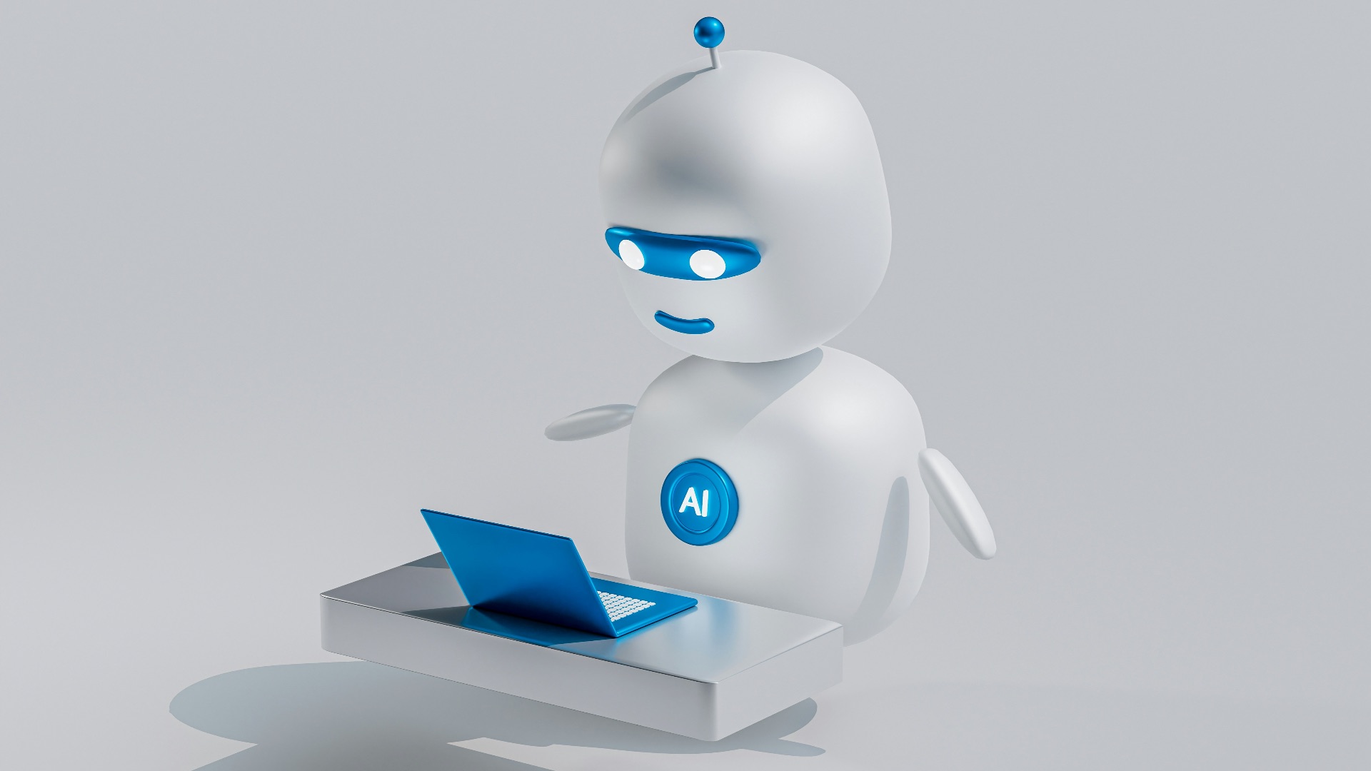 a white robot with blue eyes and a laptop