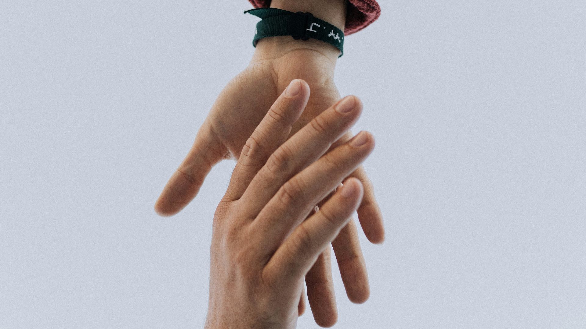 view of two persons hands