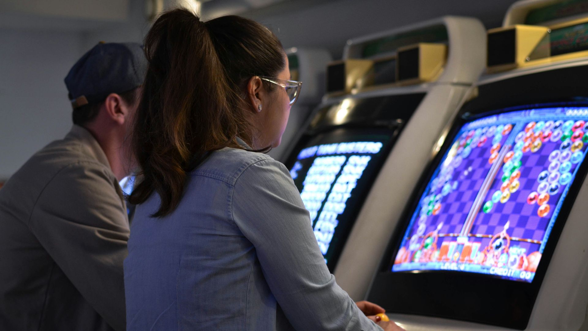 woman in gray long sleeve shirt wearing eyeglasses