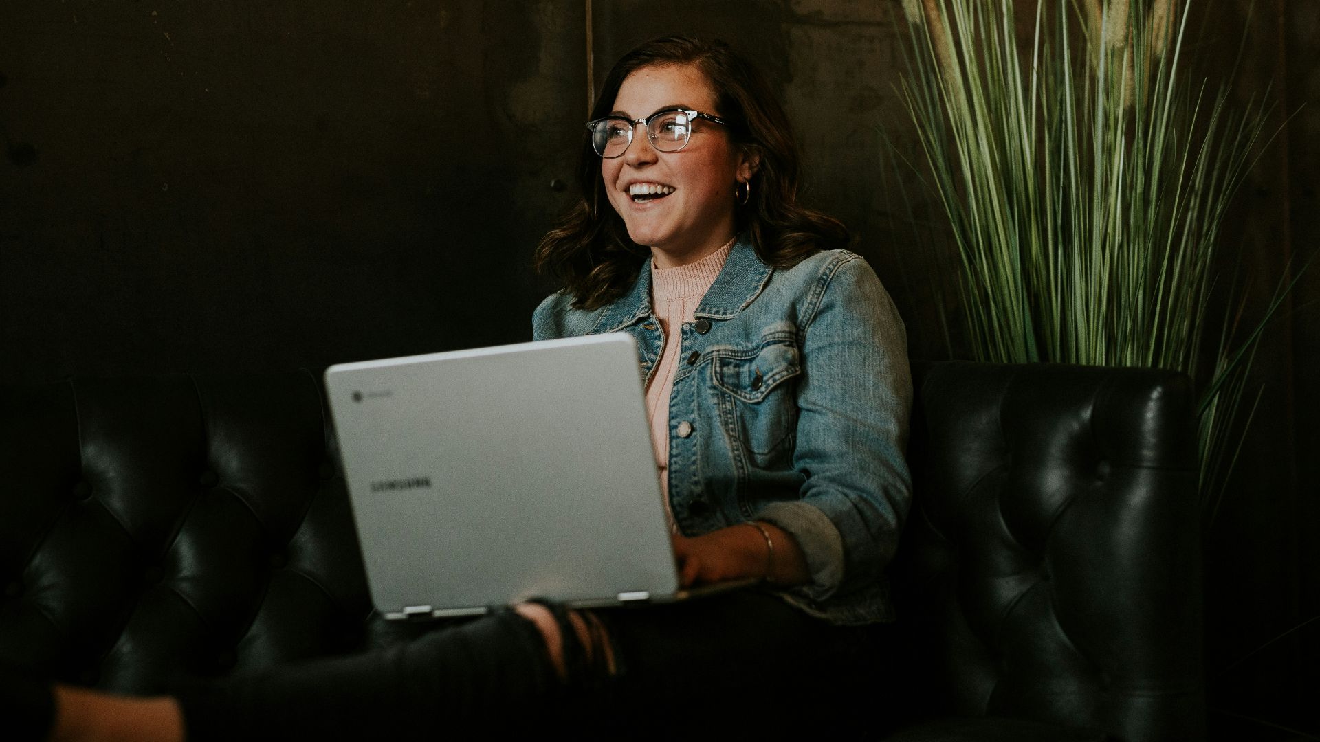 silver laptop on woman's lap