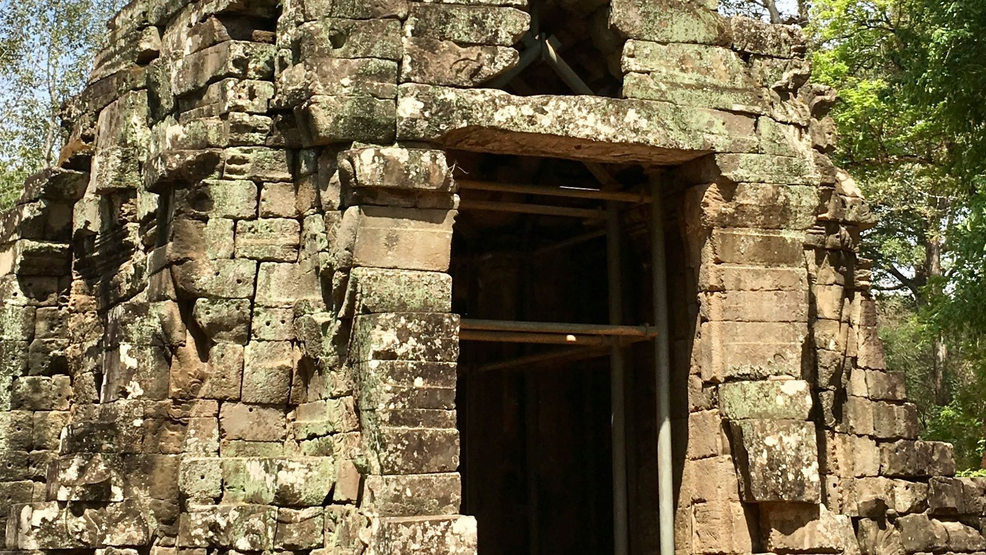 a large stone structure with a door in the middle of it