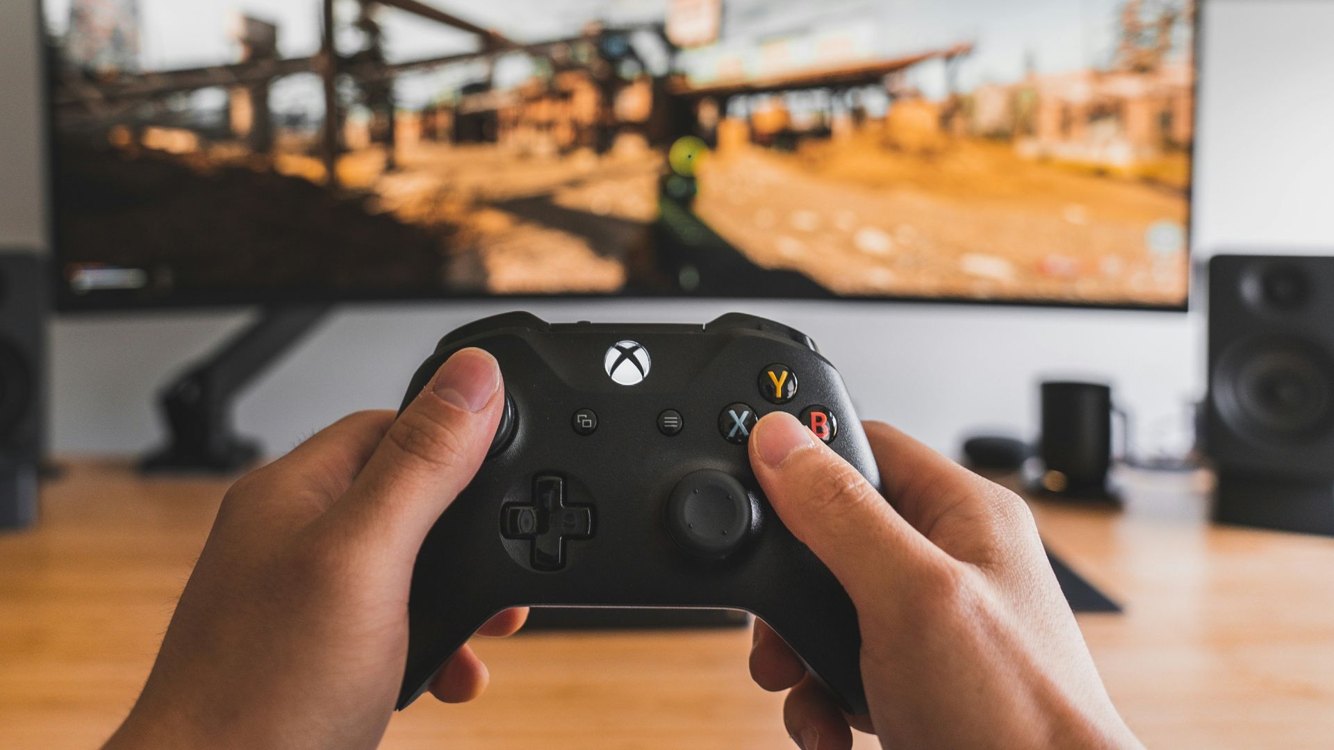 person holding black game controller