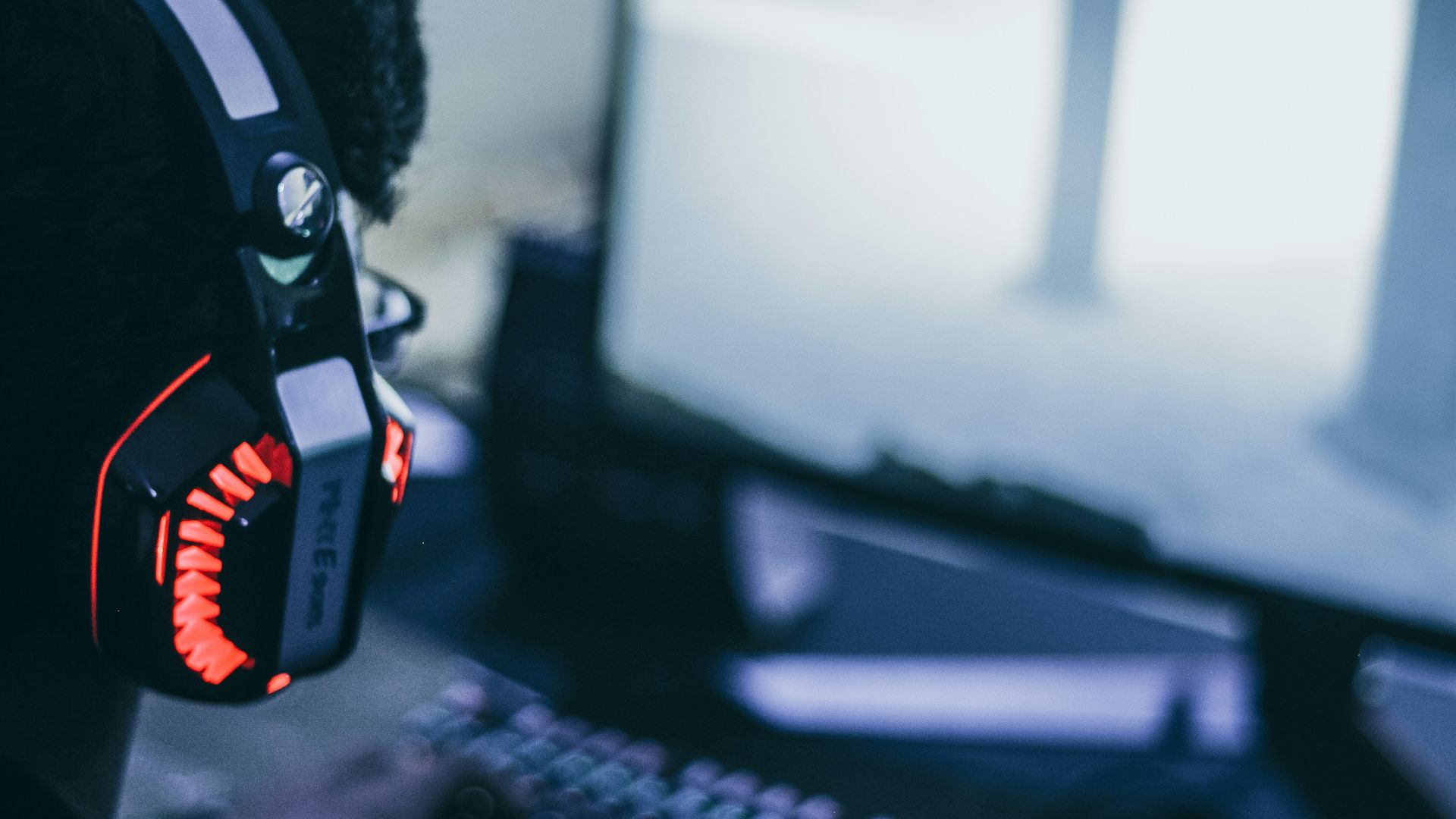 person wearing orange and black headphones