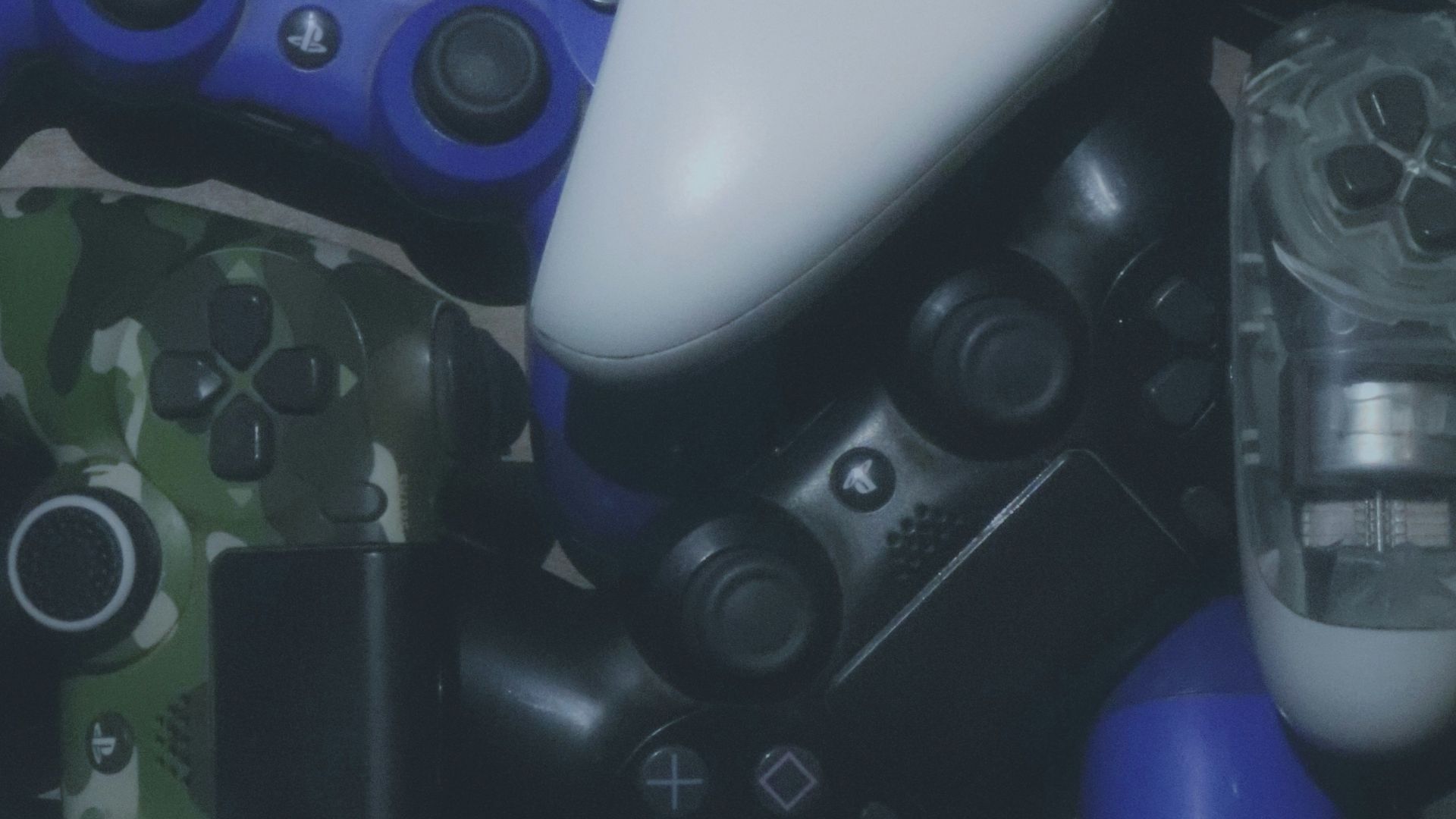 assorted-colored Xbox and Sony Playstaion game controller lot