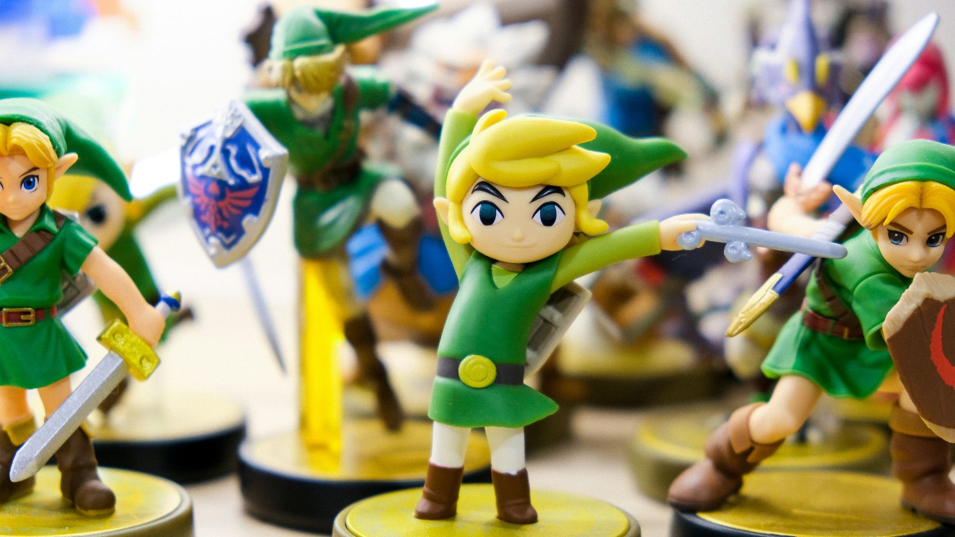 selective focus photography of Link vinyl figures