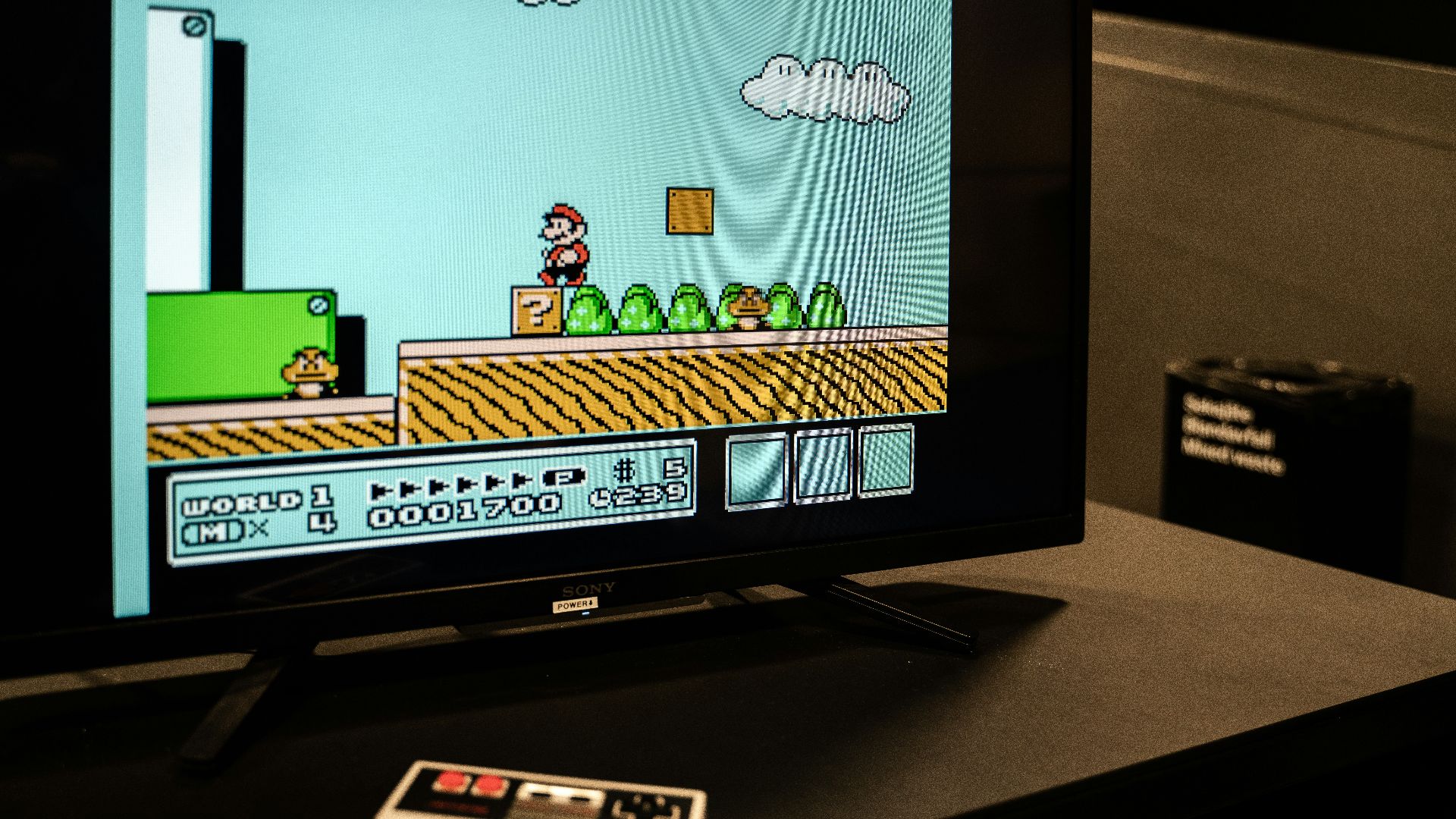 a flat screen tv sitting on top of a table