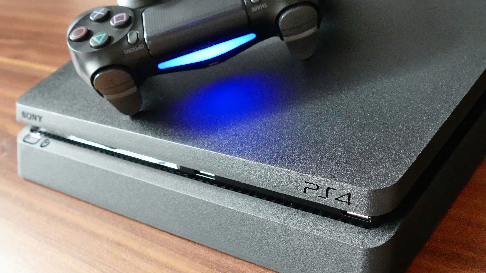a video game console sitting on top of a wooden table