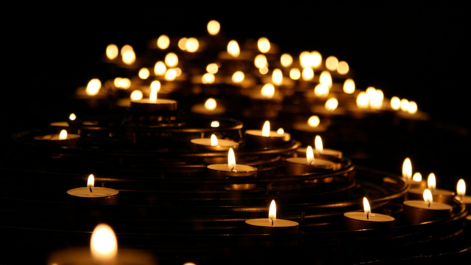 low-angle photo of lightened candles
