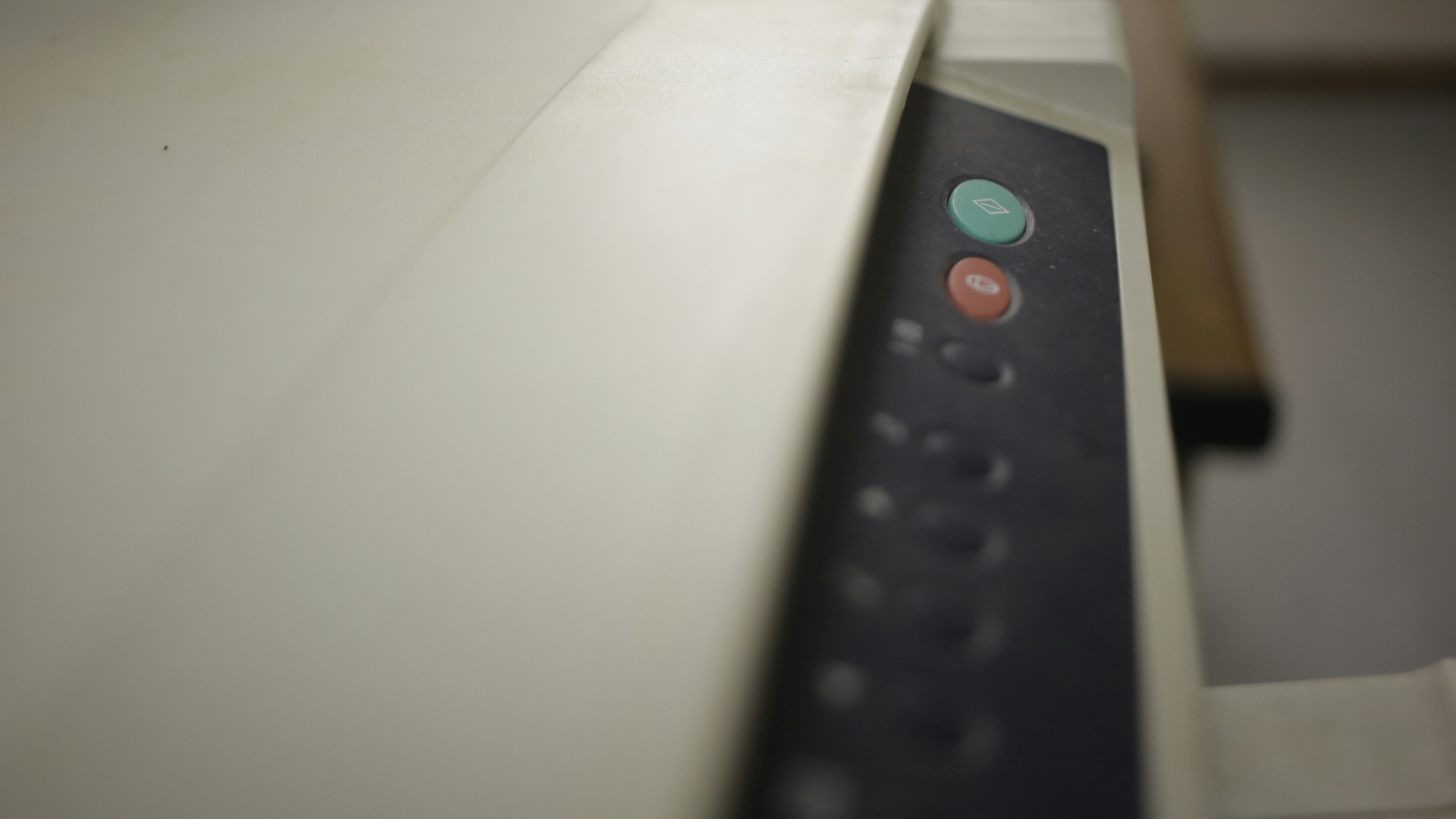 black remote control on white printer paper