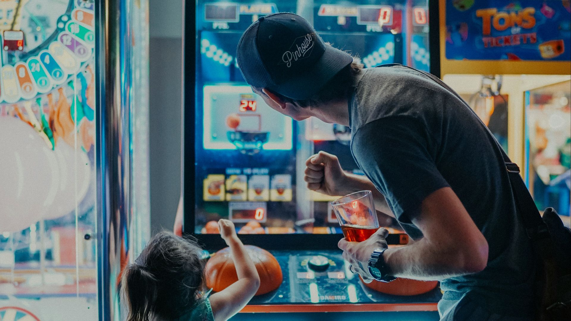 girl playing arcade game