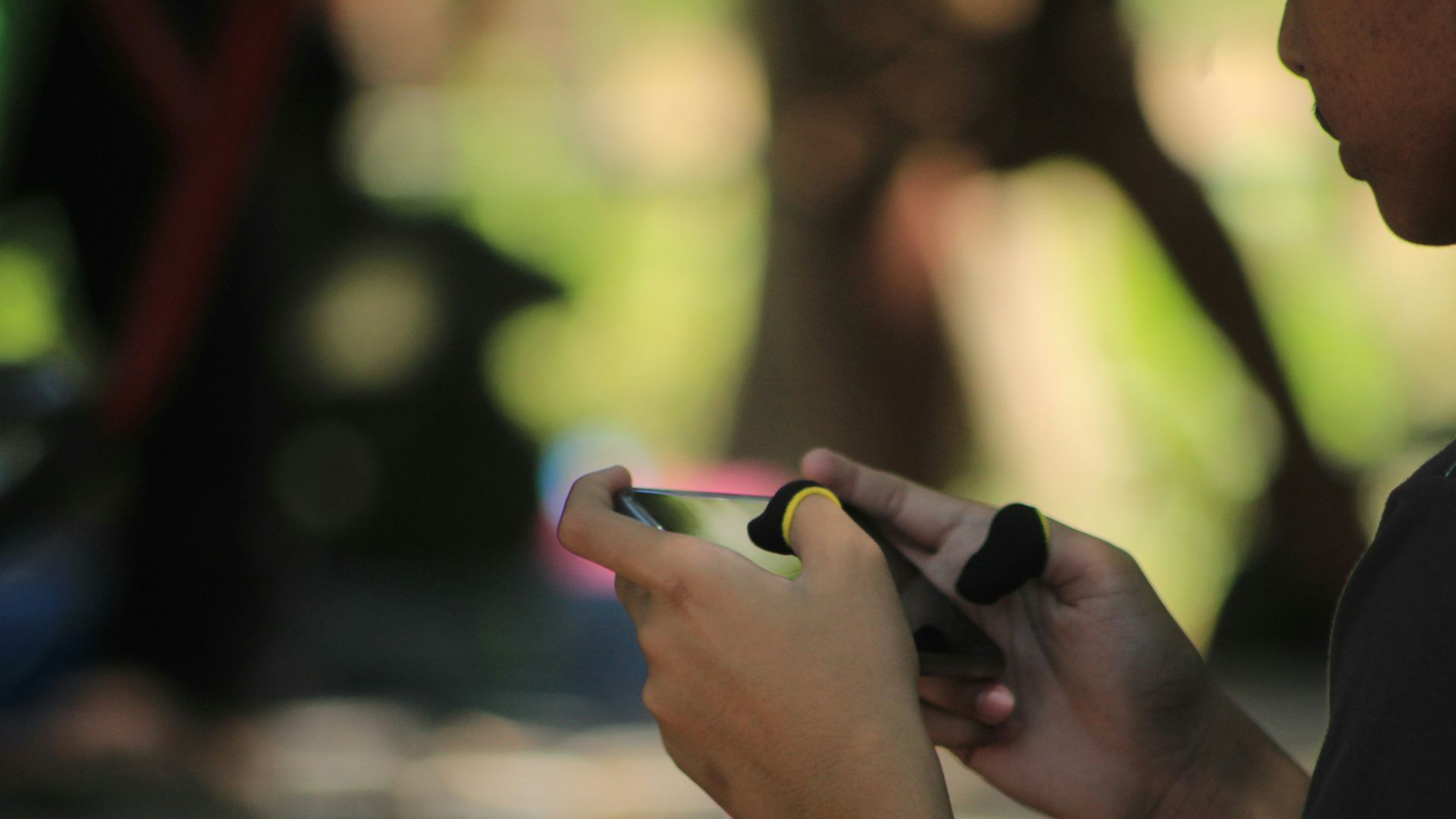 A woman is looking at her cell phone