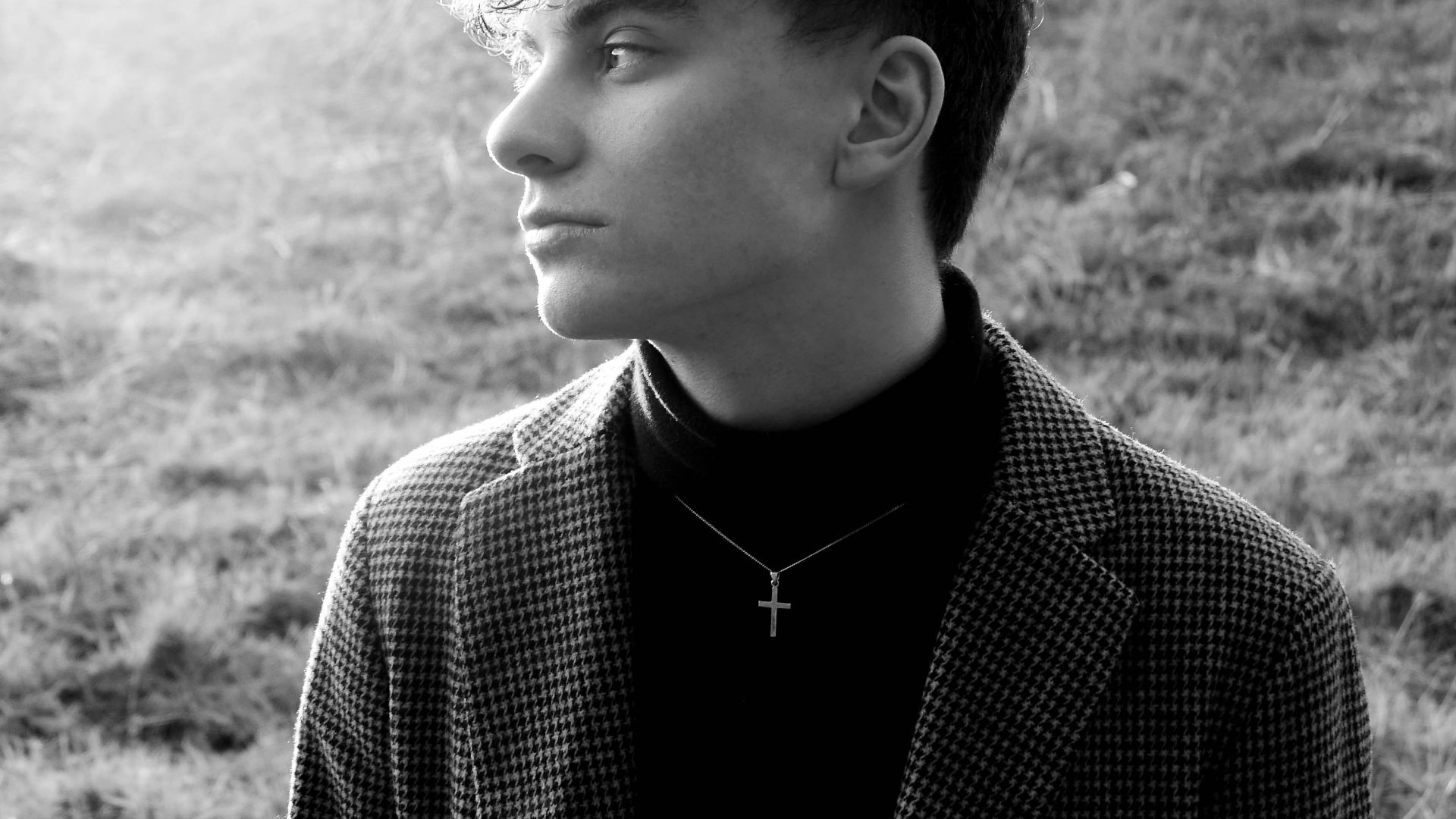 grayscale photo of woman in black and white polka dot long sleeve shirt