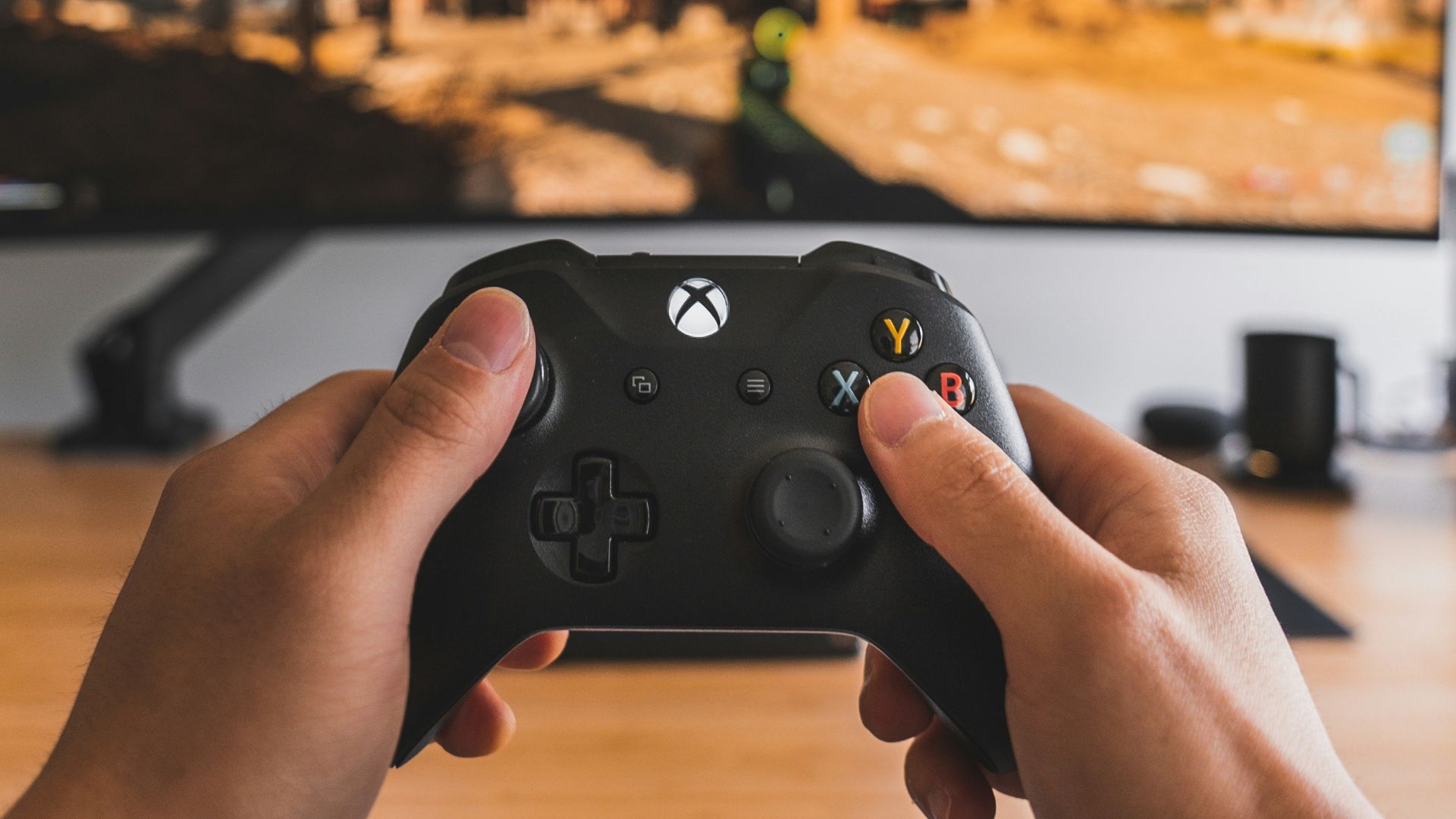 person holding black game controller