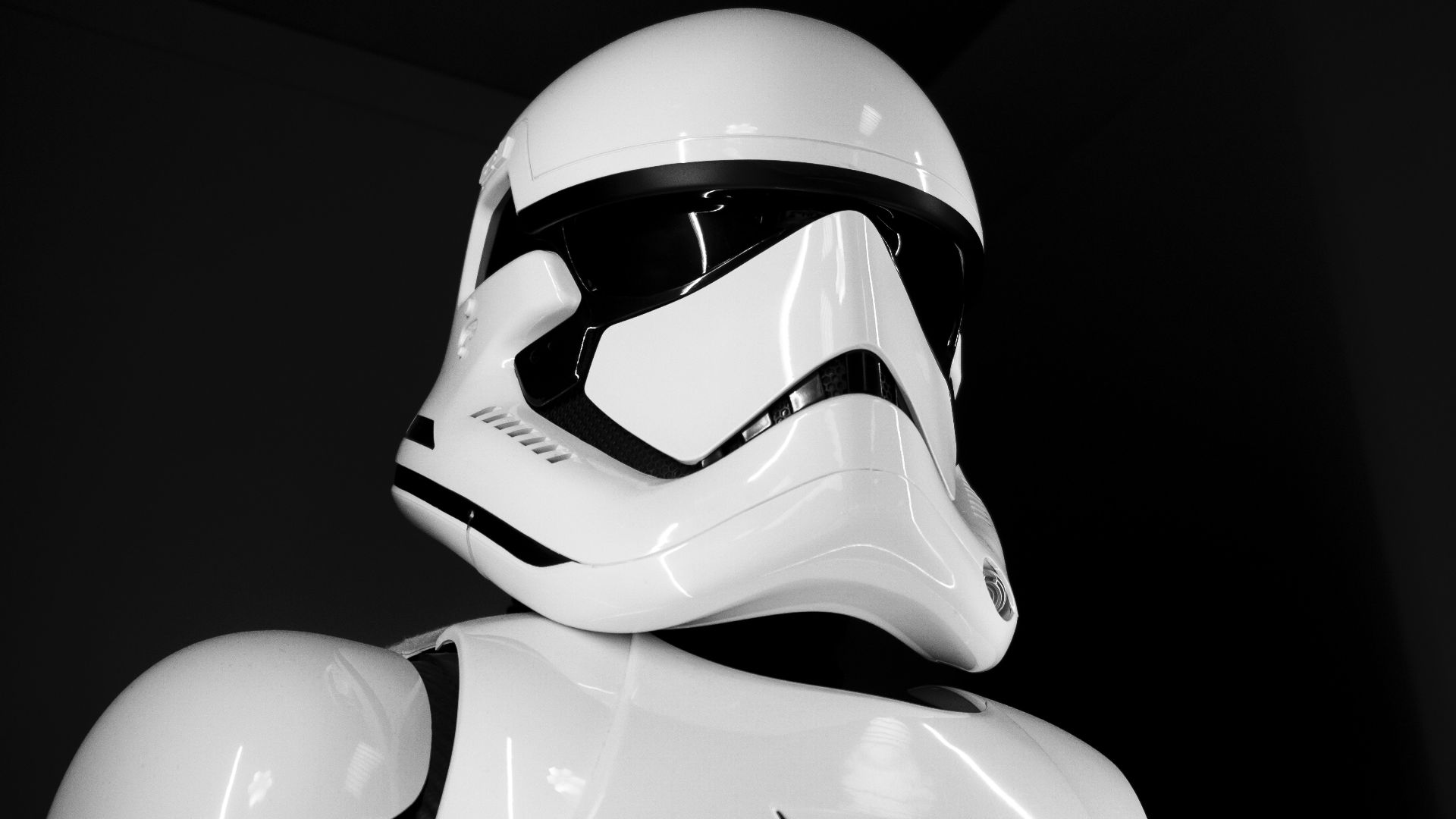 white and black helmet on black surface