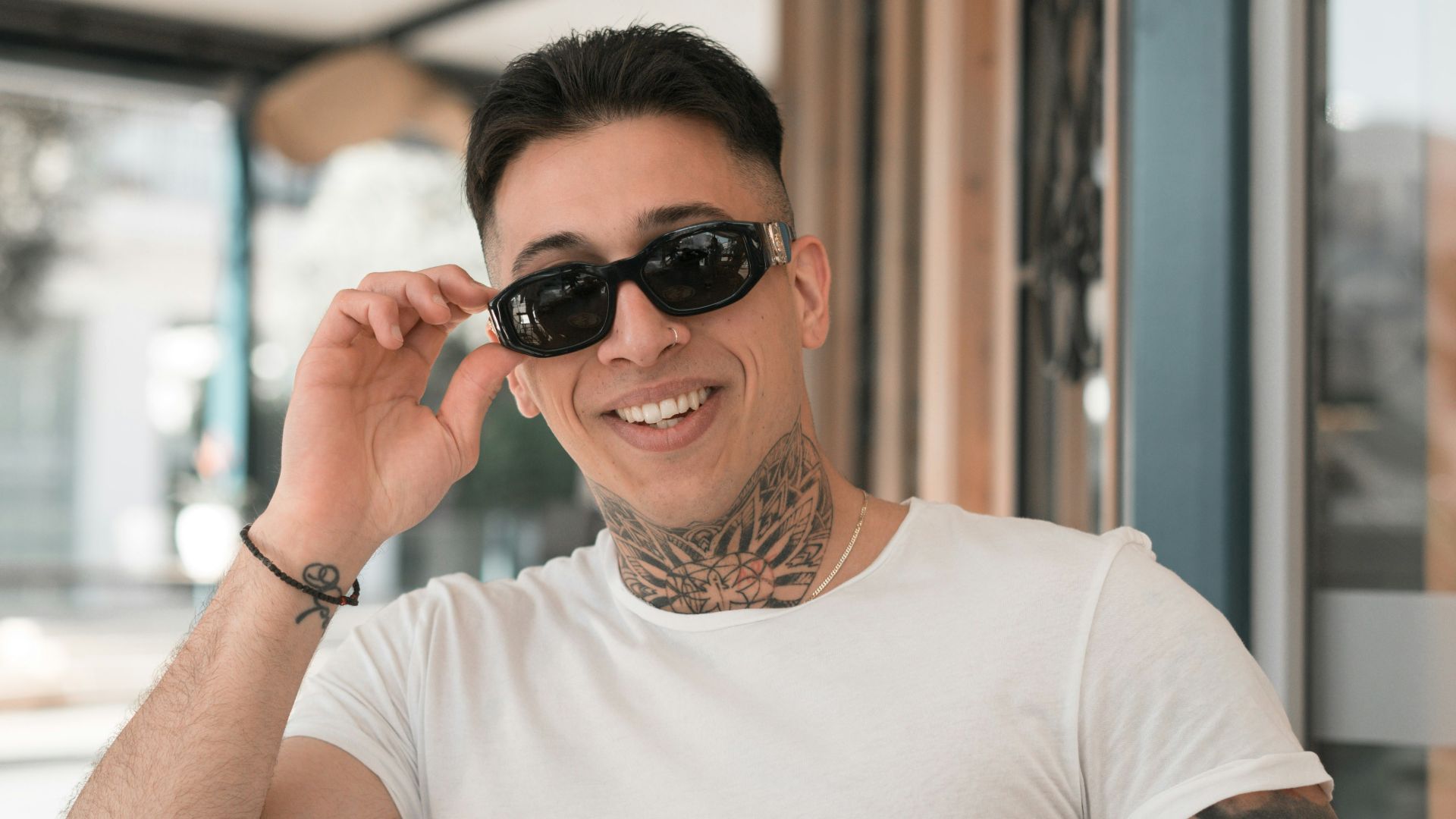 woman in white crew neck t-shirt wearing black sunglasses