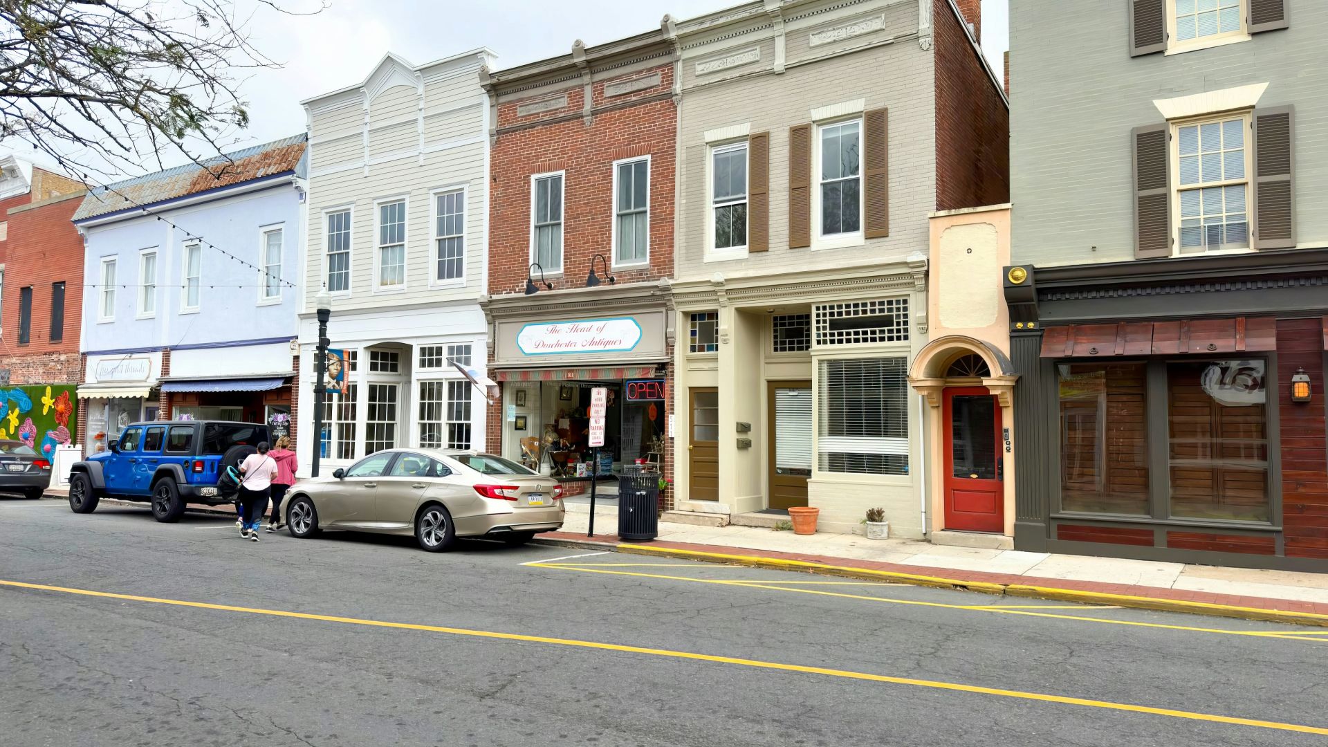 a row of buildings on a city street
