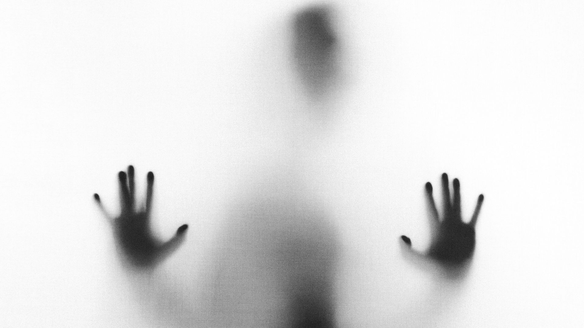 person behind fog glass