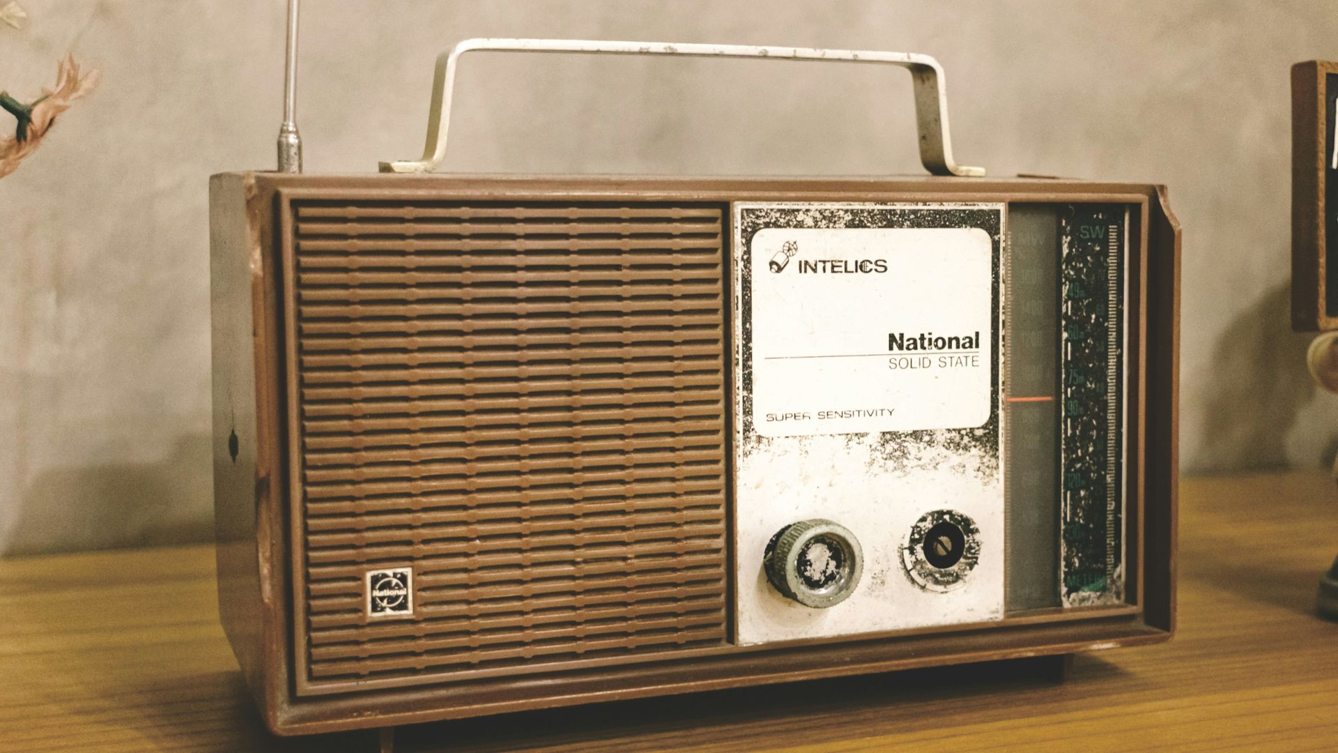 A radio sitting on top of a wooden table