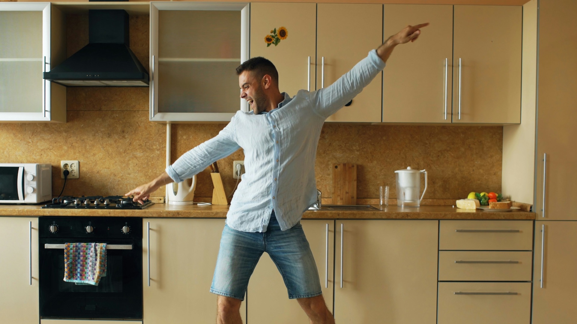 Man dancing in a modern kitchen