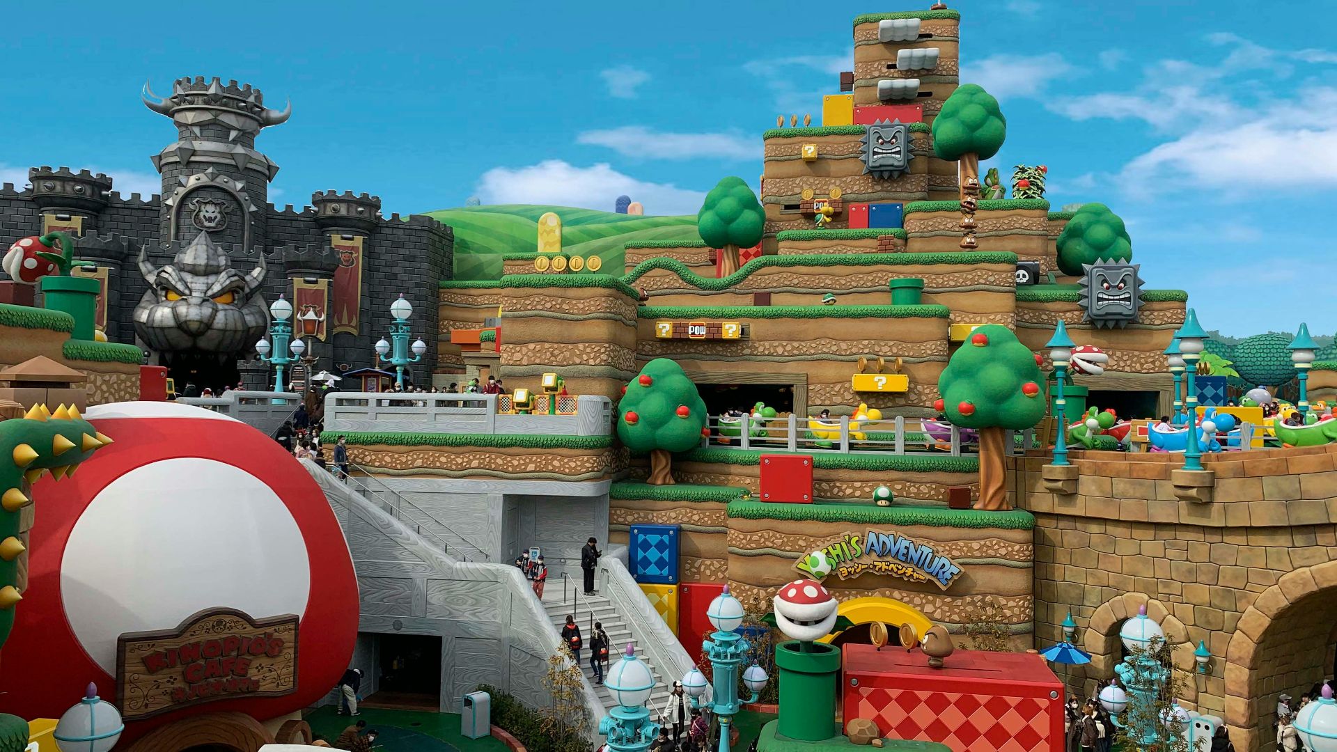 green and brown concrete building under blue sky during daytime