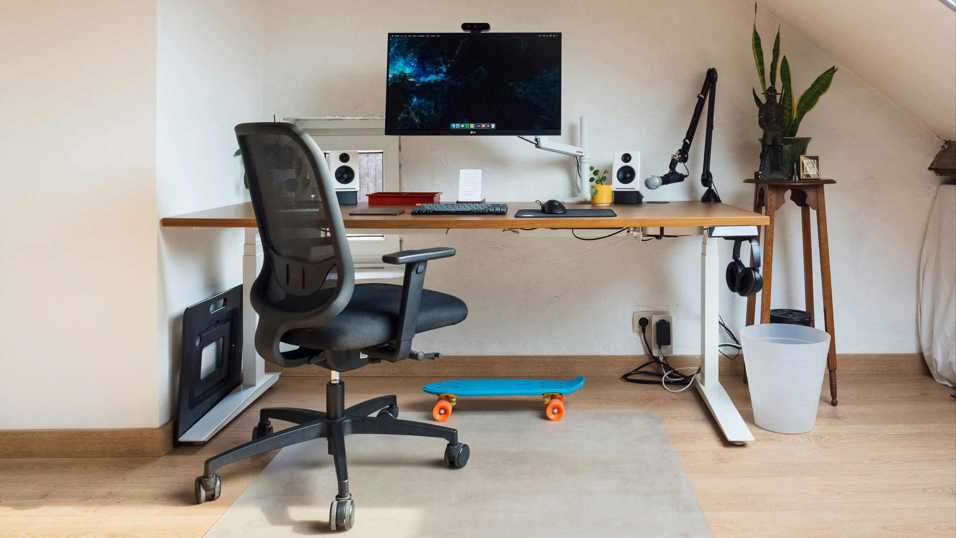 a desk with a computer on top of it