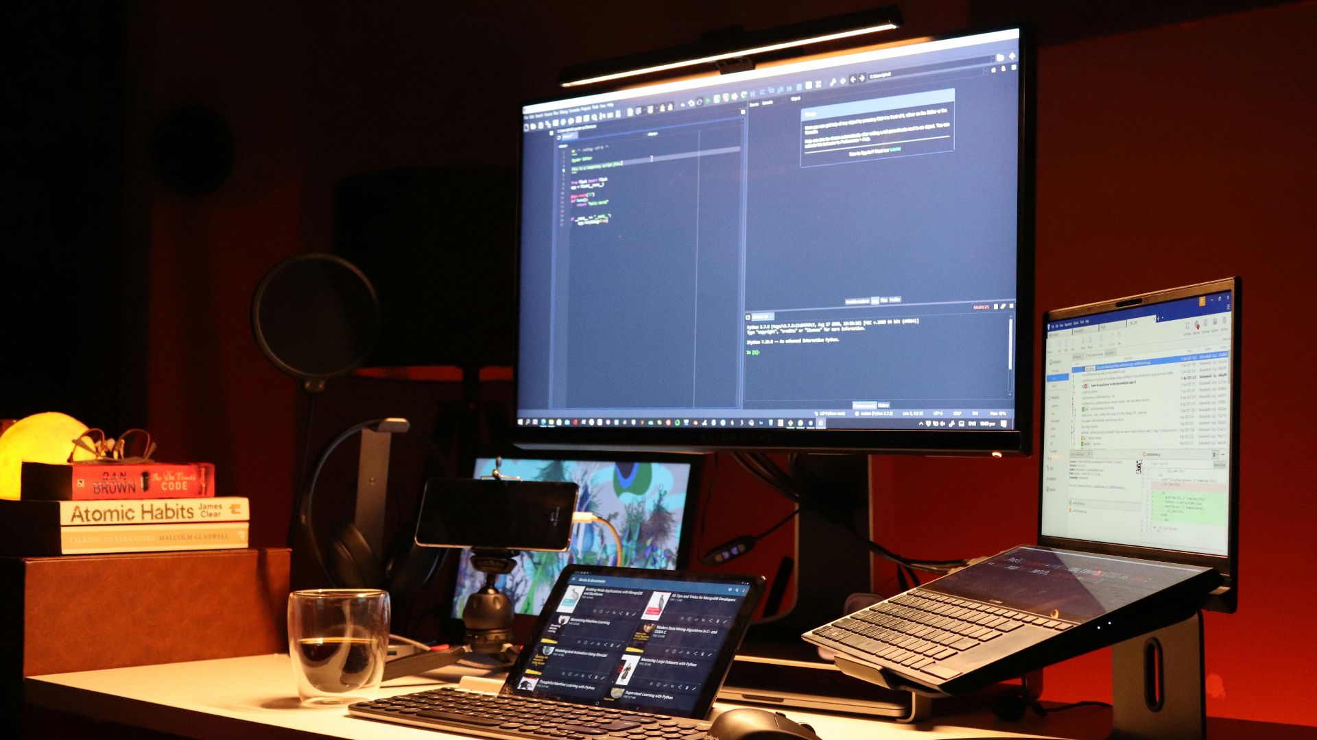 black flat screen computer monitor turned on beside black laptop computer