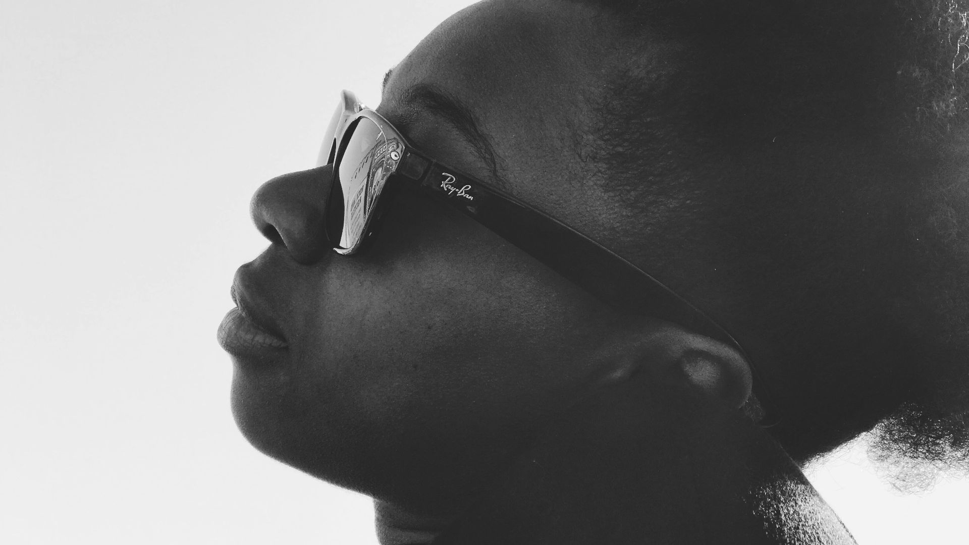 person wearing Ray-Ban sunglasses