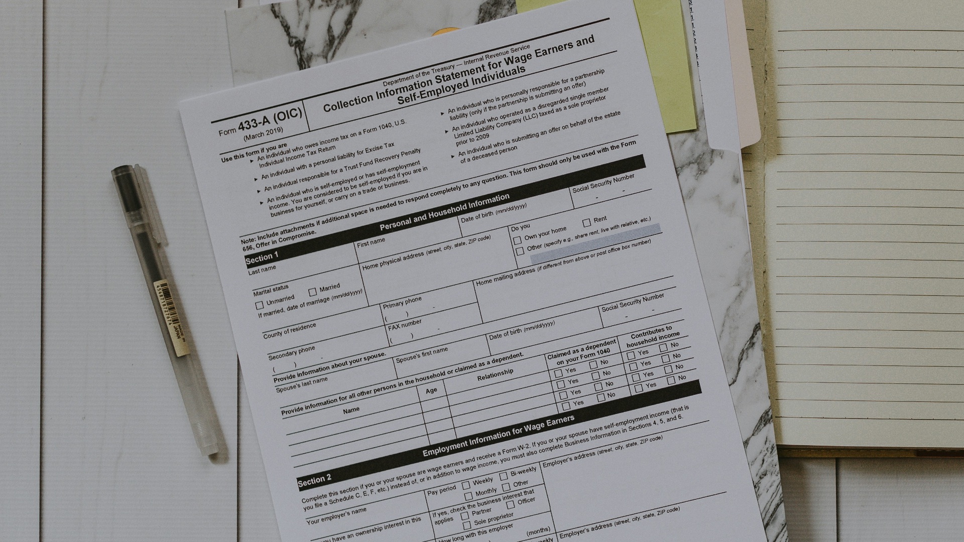 stack of papers flat lay photography