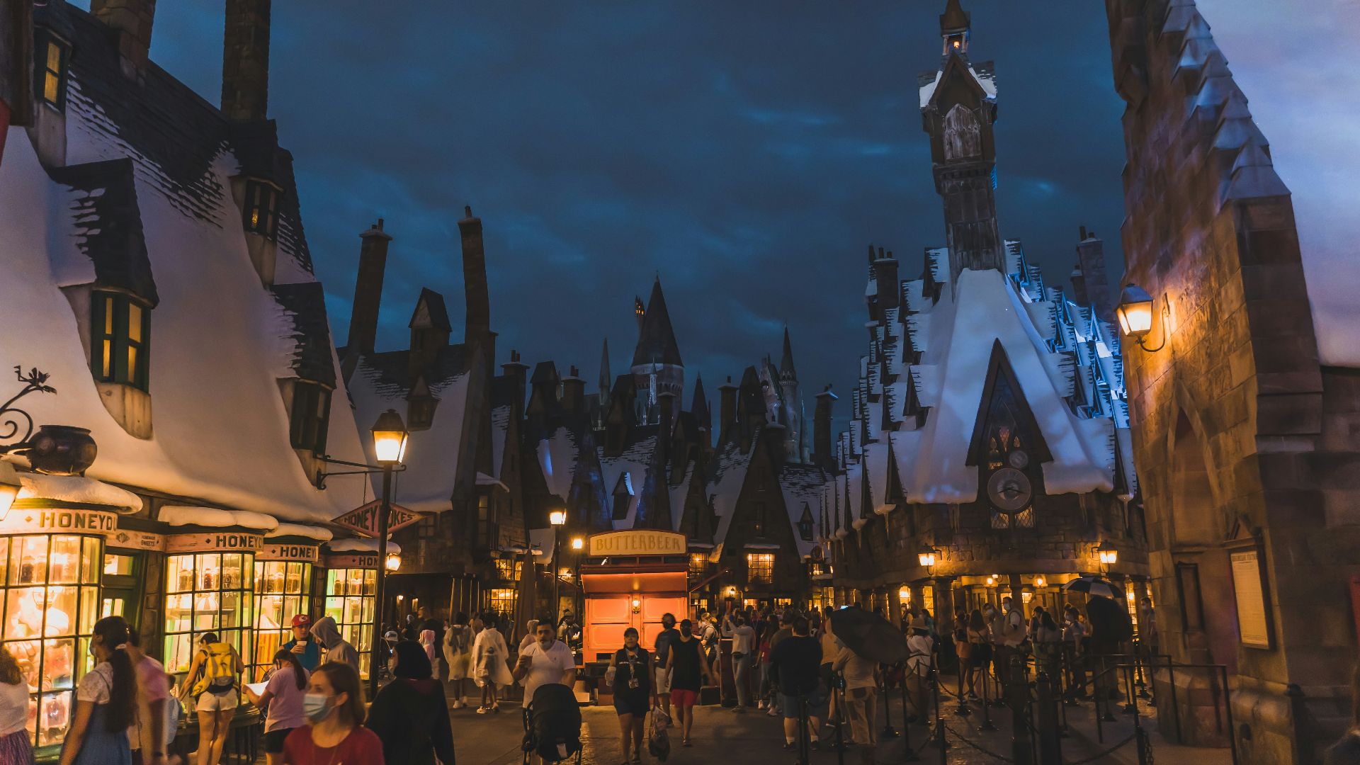 people walking on street near buildings during night time