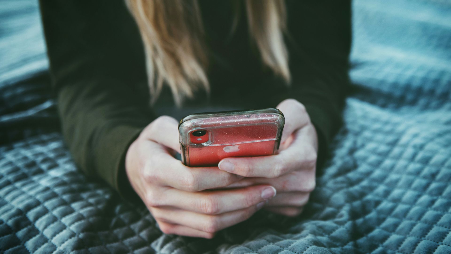 woman holding red and silver can